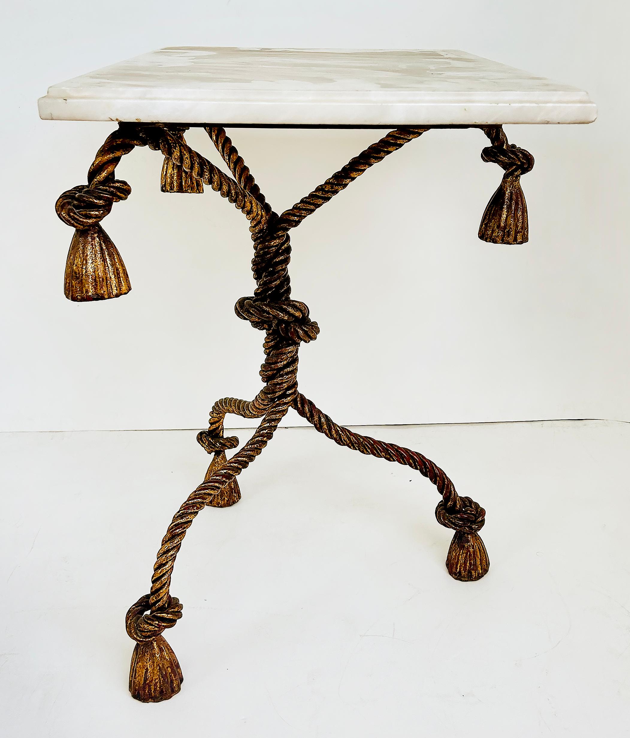 Regency Niccolini Gilt Iron Rope Tassel Marble Top Side Table, Italy

Offered for sale is a substantial Hollywood Regency Italian Niccolini gilt wrought iron rope and tassel marble top square side table. The table has a great look with a rich patina