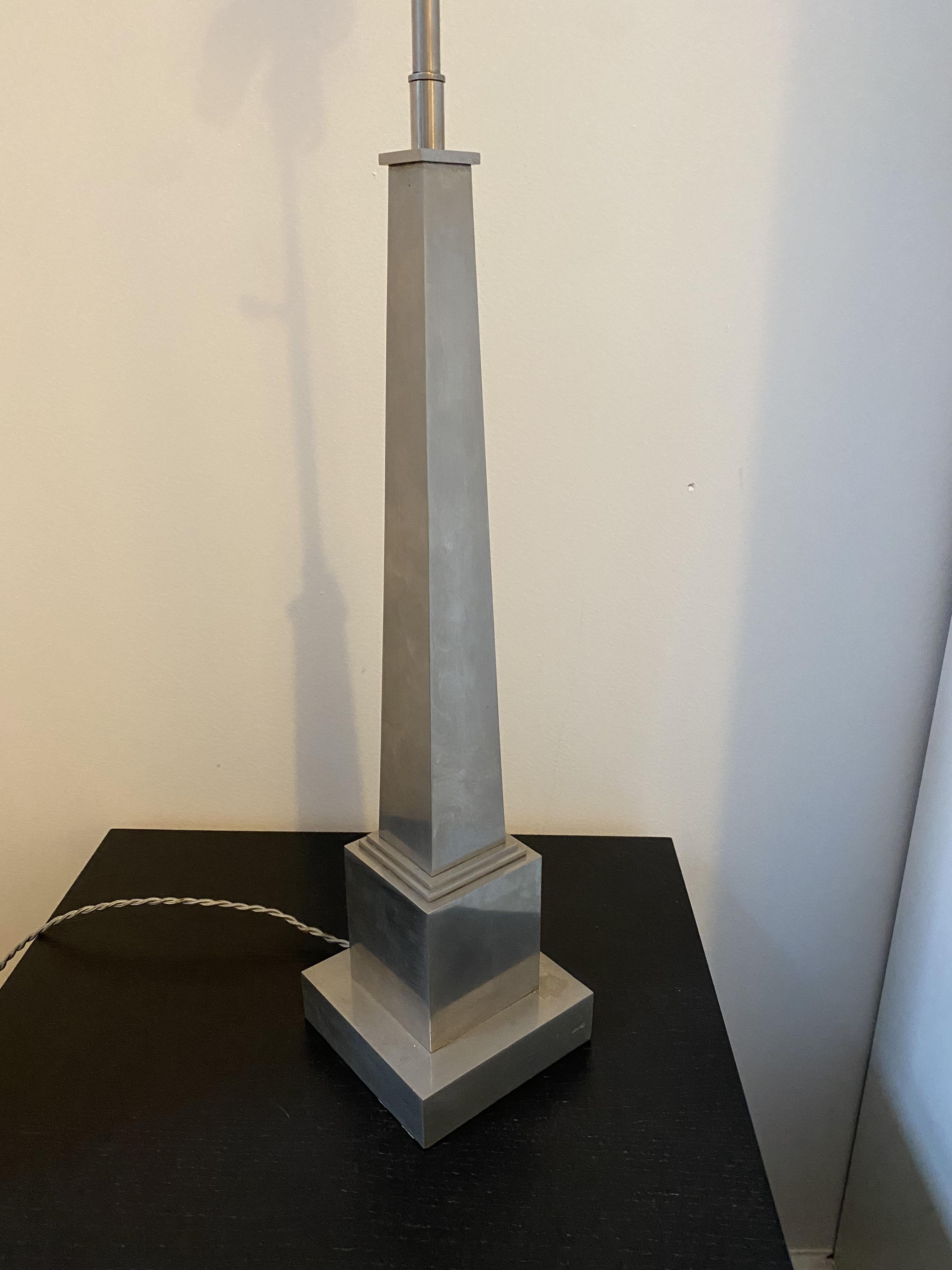 Obelisk-shaped lamp by Maison Charles in chromed bronze from the 1960s. Signed “Charles & Fils.”