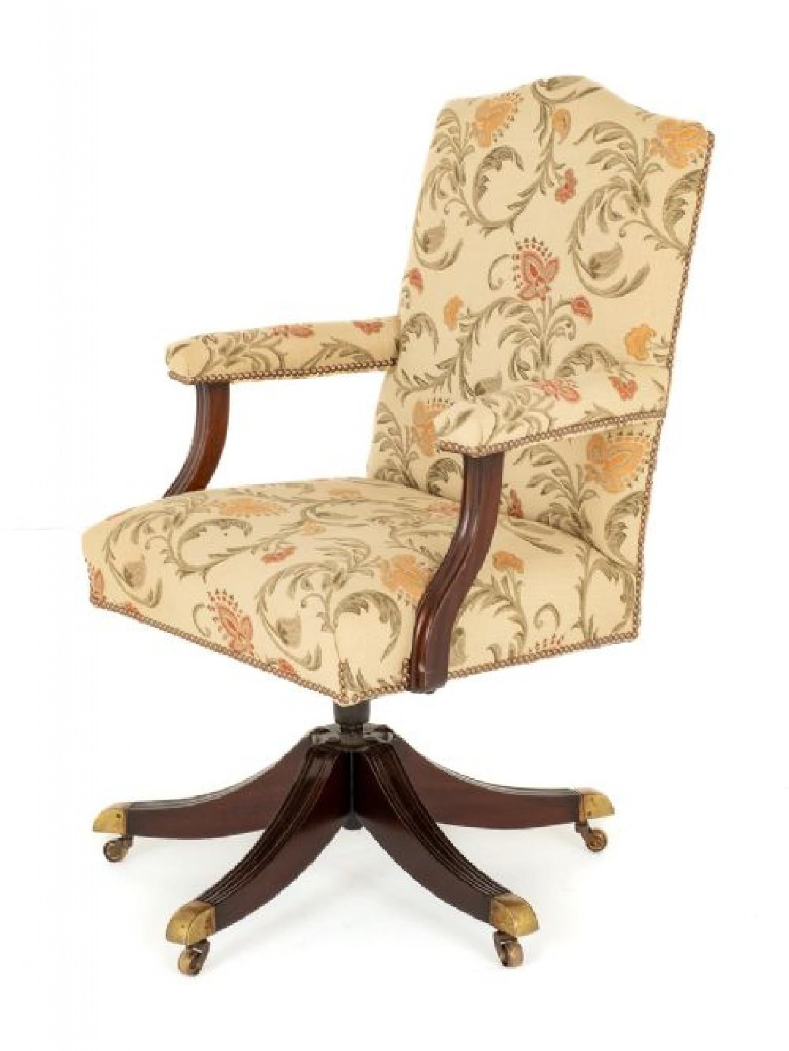 Regency Revival Mahogany Swivel Office Chair.
Circa 1930
This Office Chair Standf Upon Shaped and Fluted Legs with Brass Castors.
The Arm Supports Being of a Shaped Form.
The Chair Has a Tilt and Swivel Action and Has Recently Been Reupholstered