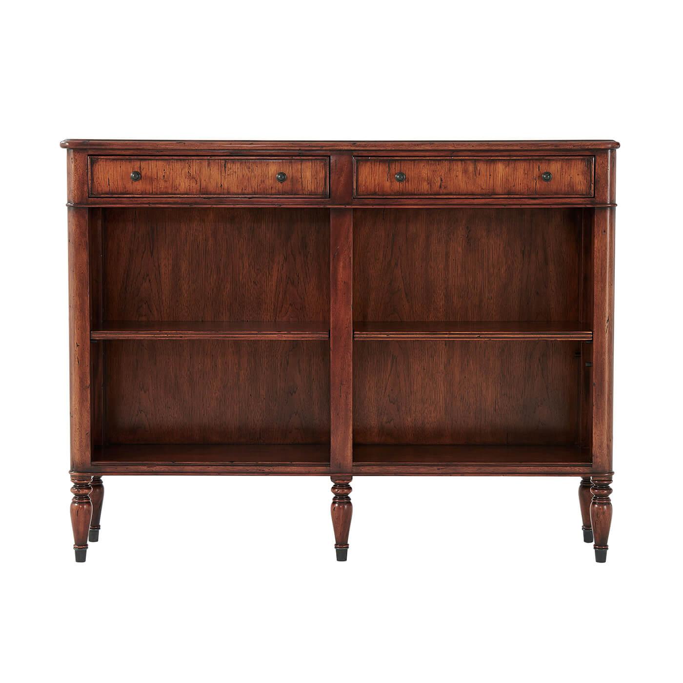 A Regency style open bookcase, the leather inlaid top above two frieze drawers with adjustable open shelves below, on turned legs. 

Dimensions: 47