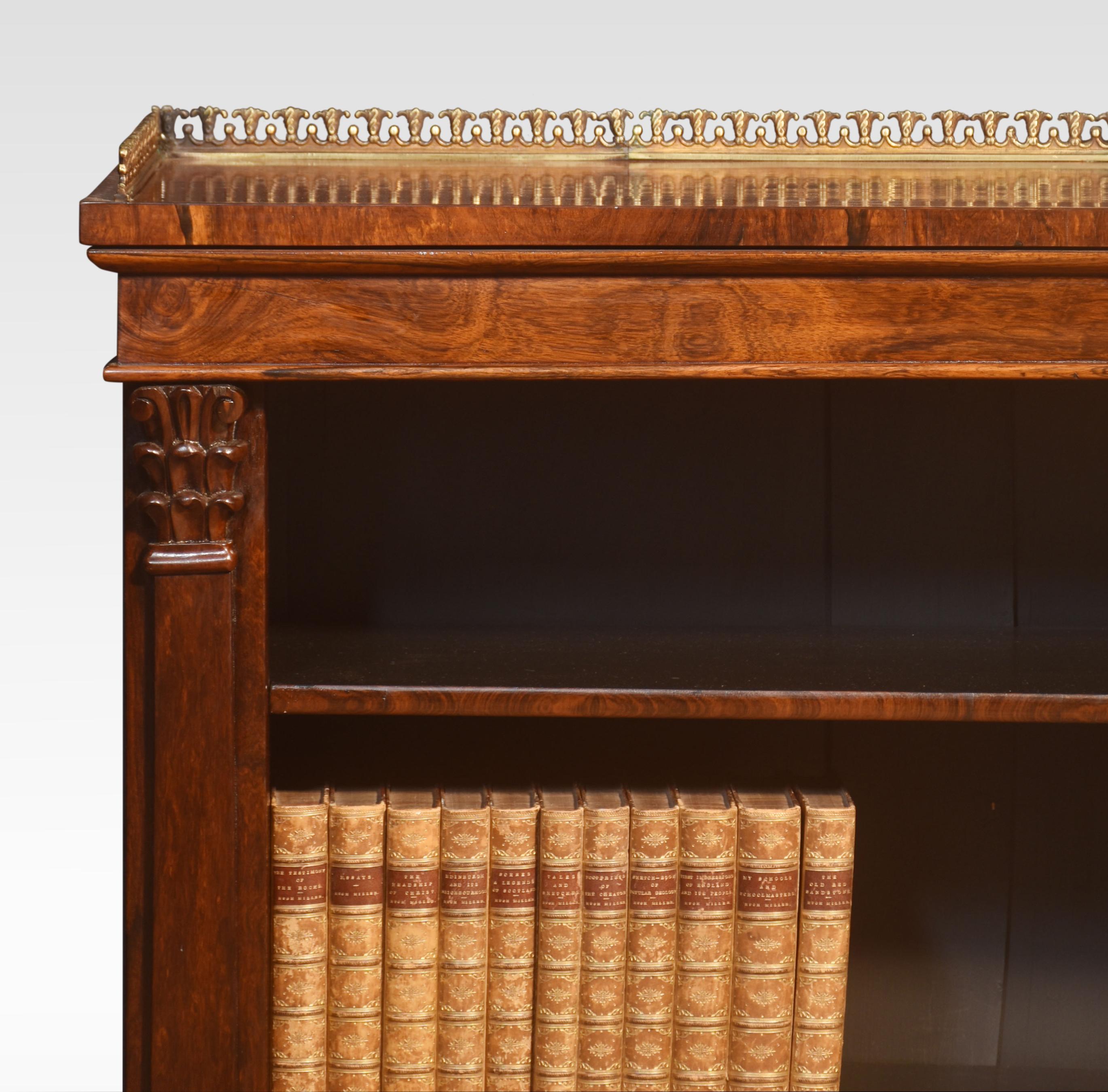 19th-century open bookcase, the rectangular well-figured top having raised pierced three quarter gallery. Above moulded frieze supported on carved capped columns. Enclosing two adjustable shelves, all raised up on a plinth base.
Dimensions
Height