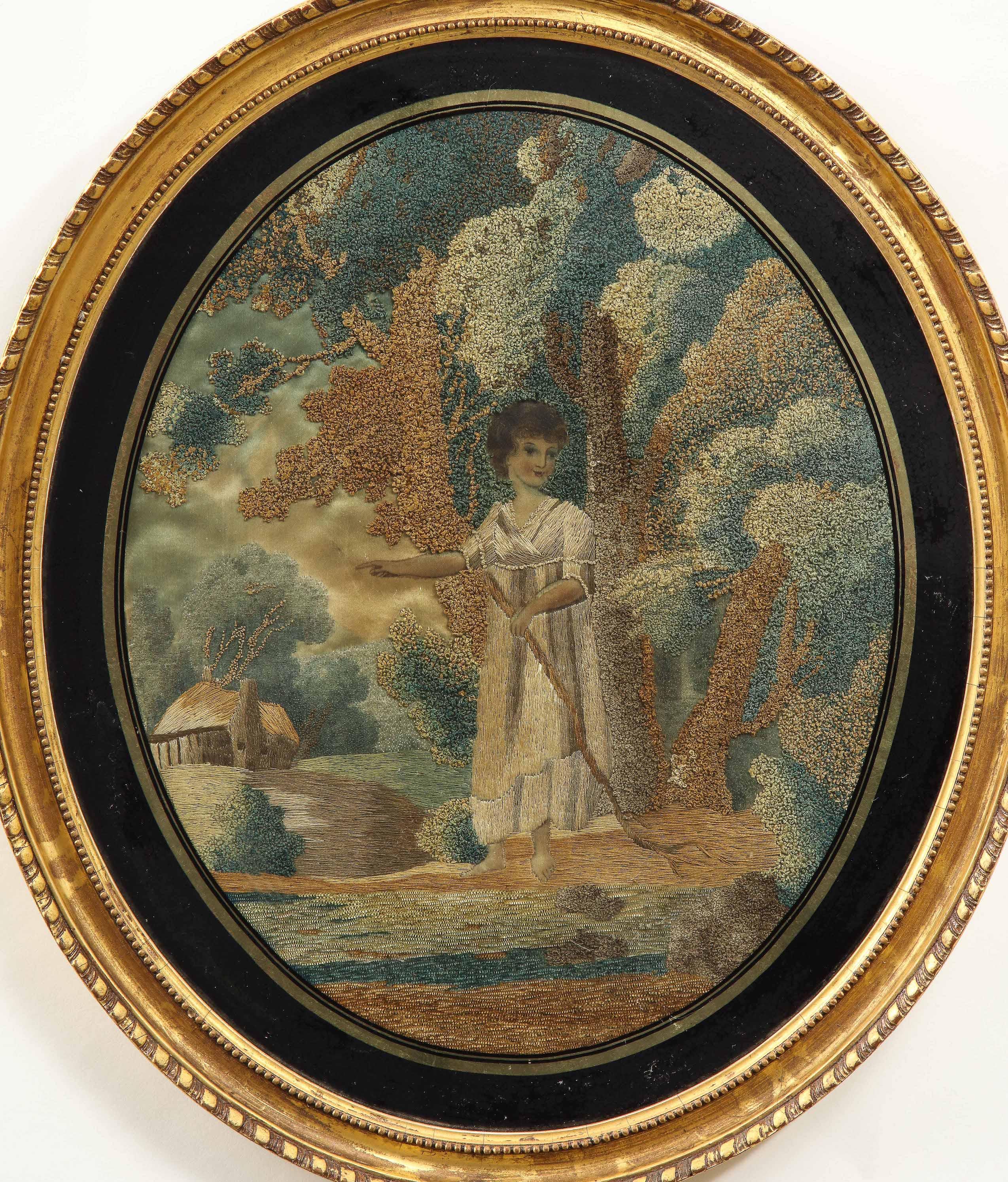 Extremely fine embroidery of a neoclassical maiden dressed as a shepherdess in a forest with a rustic thatched cottage in background. Wonderful use of short and long stitches and shading on the foliage. The figure's face and feet painted. Set within