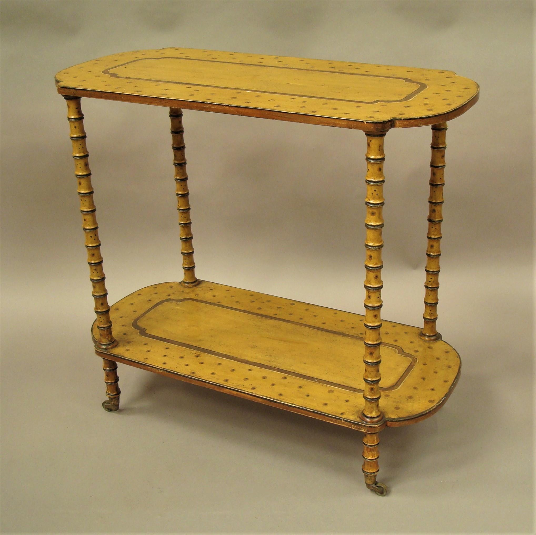 Unusual Regency painted faux bamboo centre or occasional table; in the Brighton Pavilion style decorated on a yellow ochre background; the rectangular top with re-entrant corners and bow ends with a plain central panel and a decorated border of