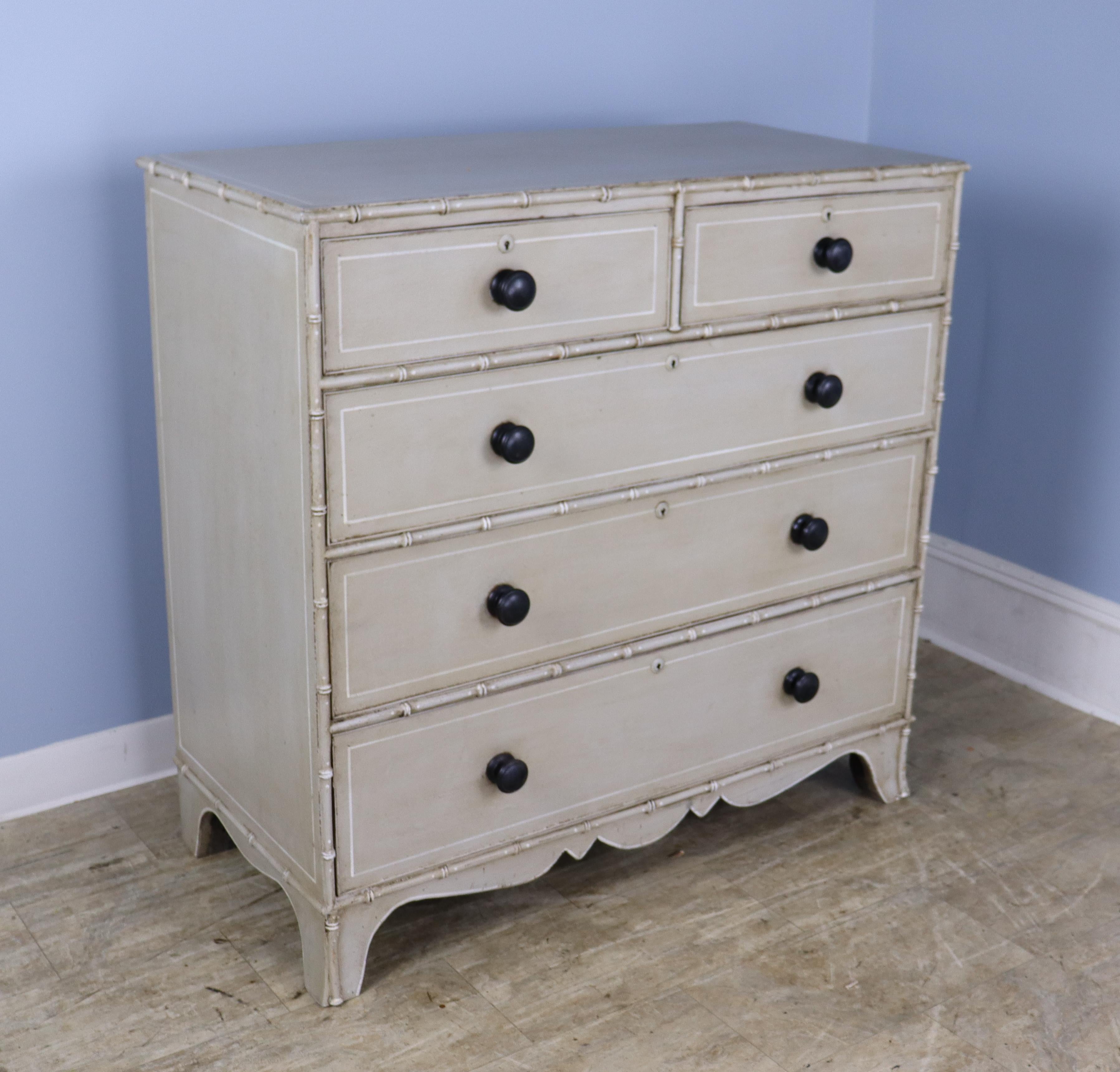 A charming Regency chest of drawers with bamboo detail, newly painted in an antique light gray, finished with beeswax to create a faux distressed effect. Perfectly suited to a beach cottage, child's room or guest room. Roomy drawers open and shut