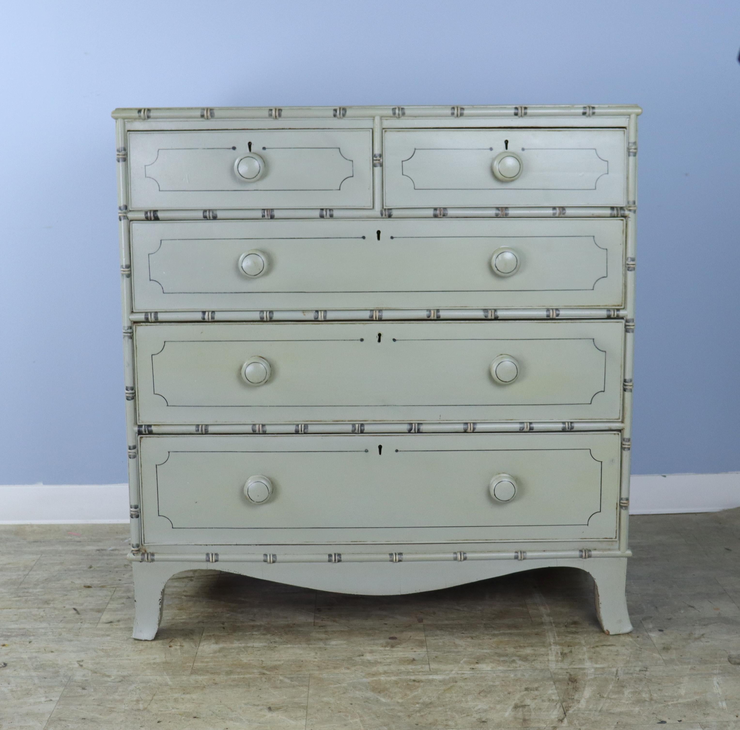 A charming Regency chest of drawers with bamboo detail, newly painted in an antique light green/gray, finished with beeswax to create a faux distressed effect. Perfectly suited to a beach cottage, child's room or guest room. Roomy drawers open and