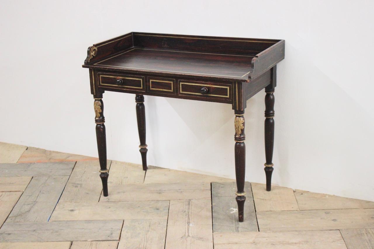 An early 19th century English Regency, painted washstand in faux rosewood with acanthus leaf detail, retaining the original paint, 

England 

Measurements: 61cm high (knee height).