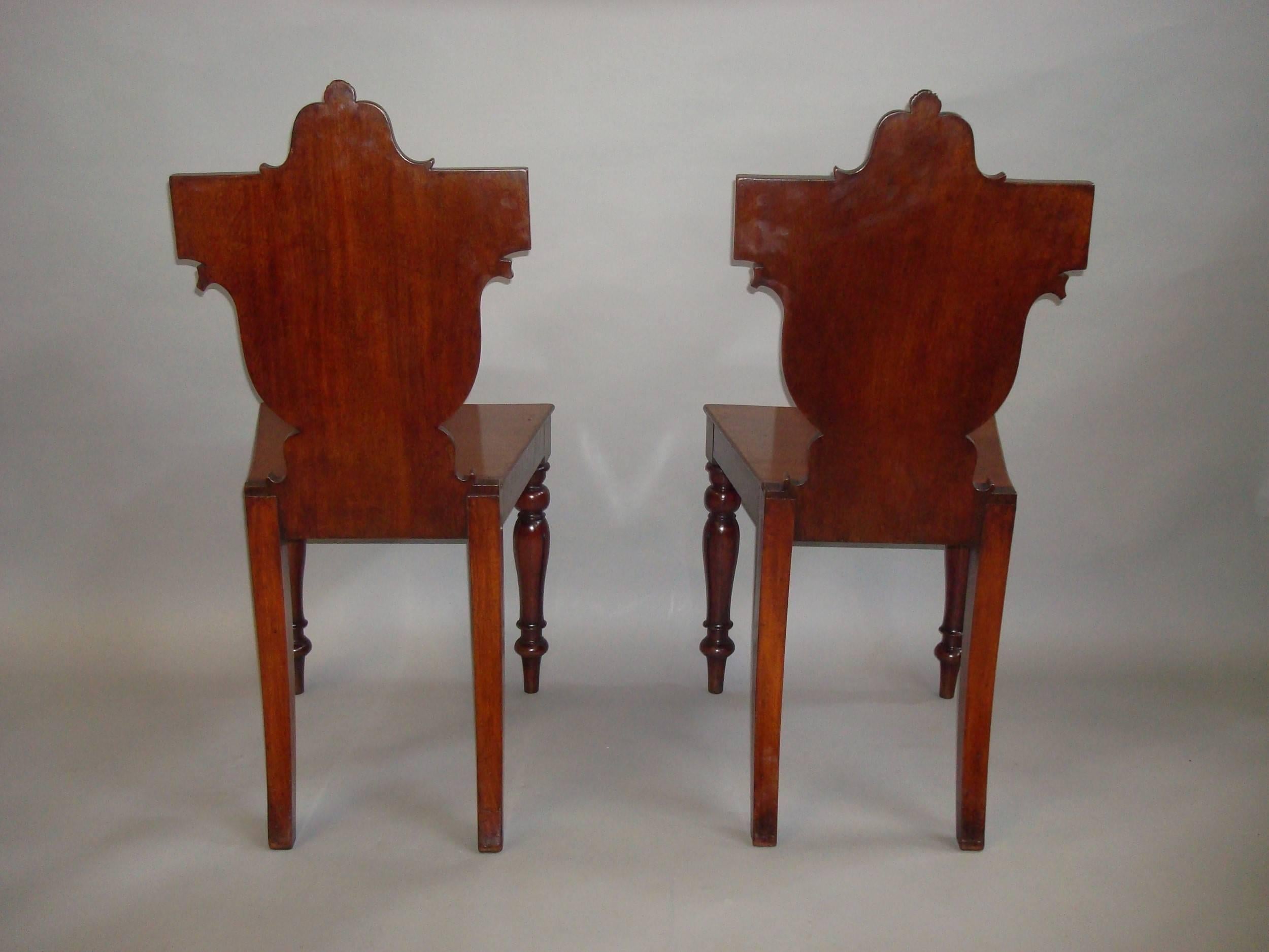 Polished Regency Pair of Irish Mahogany Hall Chairs