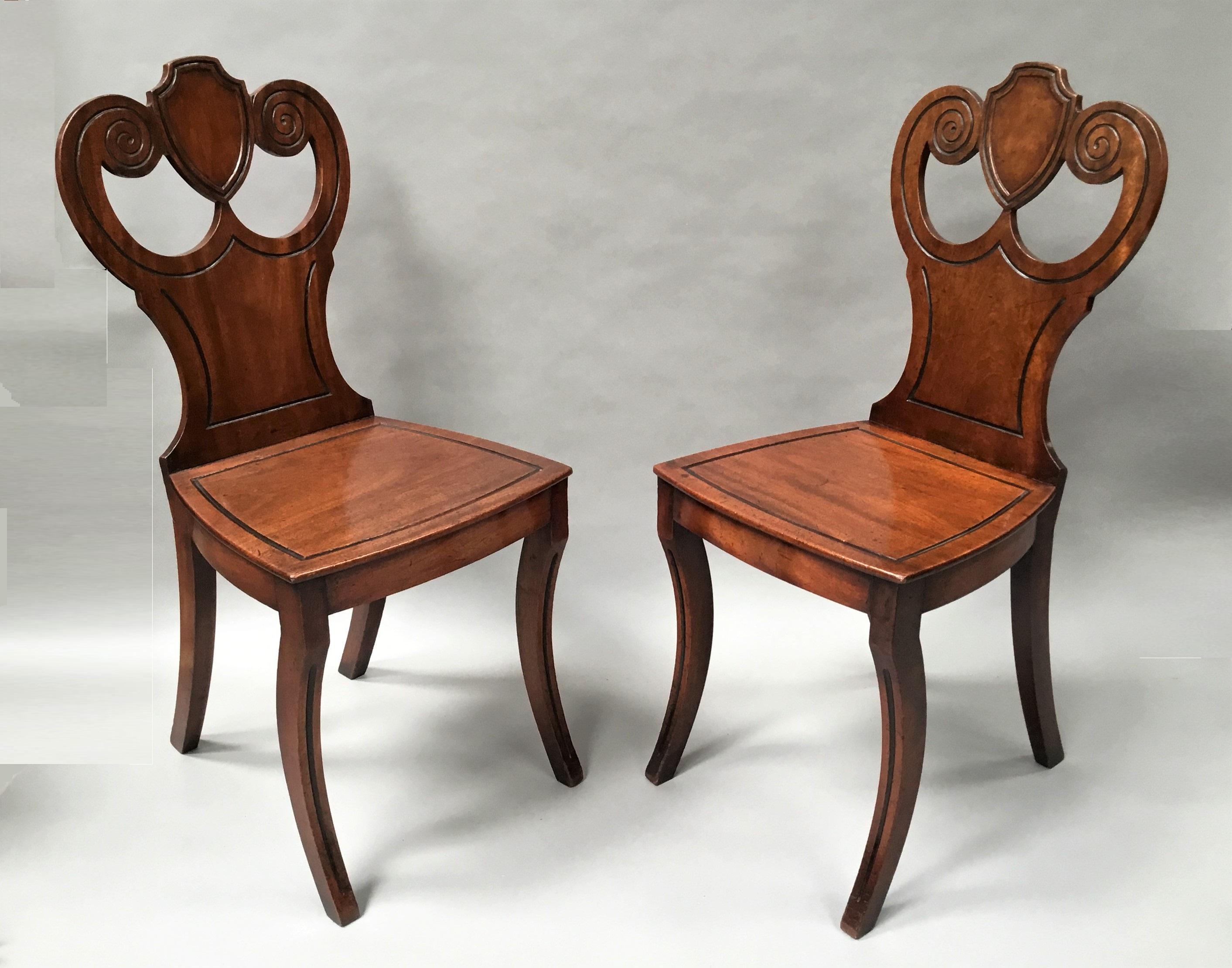 Polished Regency Pair of Mahogany Hall Chairs For Sale