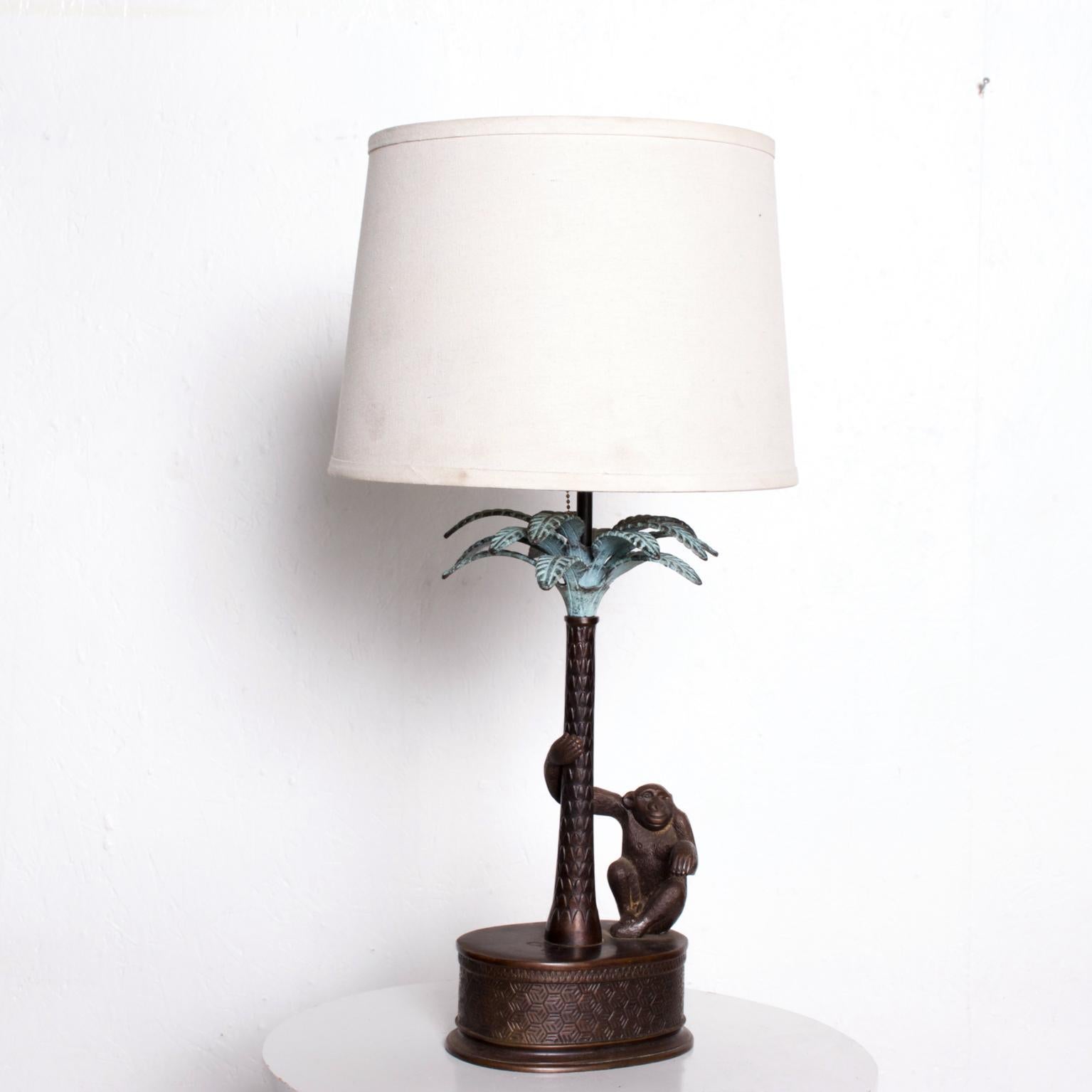 For your pleasure: Magnificent Whimsy Monkey and Palm Tree table lamp
Hollywood Regency Palm Tree with Monkey in bronze by Maitland Smith Philippines 1970s
Dimensions: 22 H x 8 W x 8 D
Original unrestored vintage condition. No lamp shade is