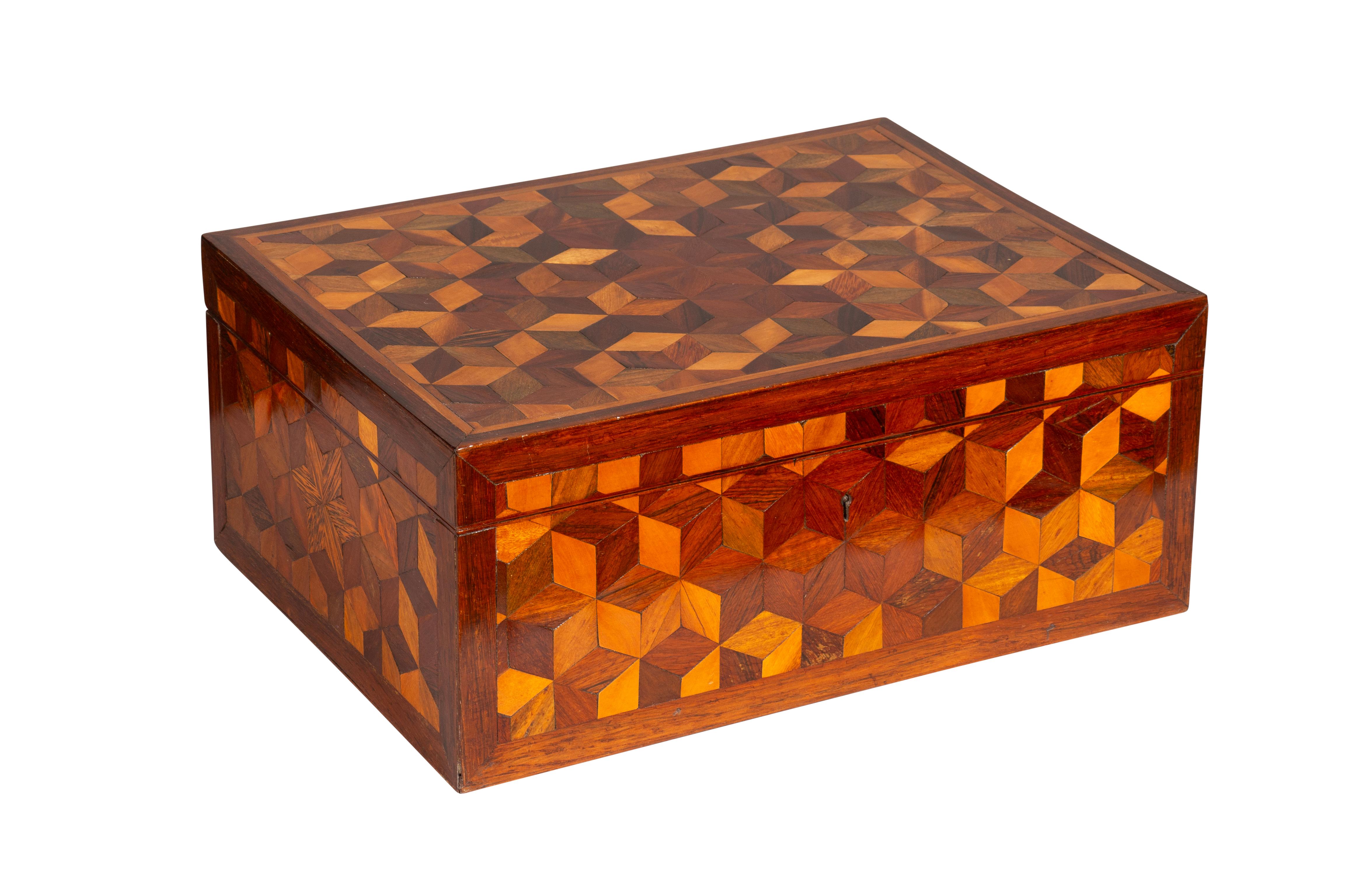 Rectangular with overall cube parquetry. Lift top. Well executed with a wide choice of exotic woods.Nice patina and presents well. From the estate of the founder of Yankee Candle Company.