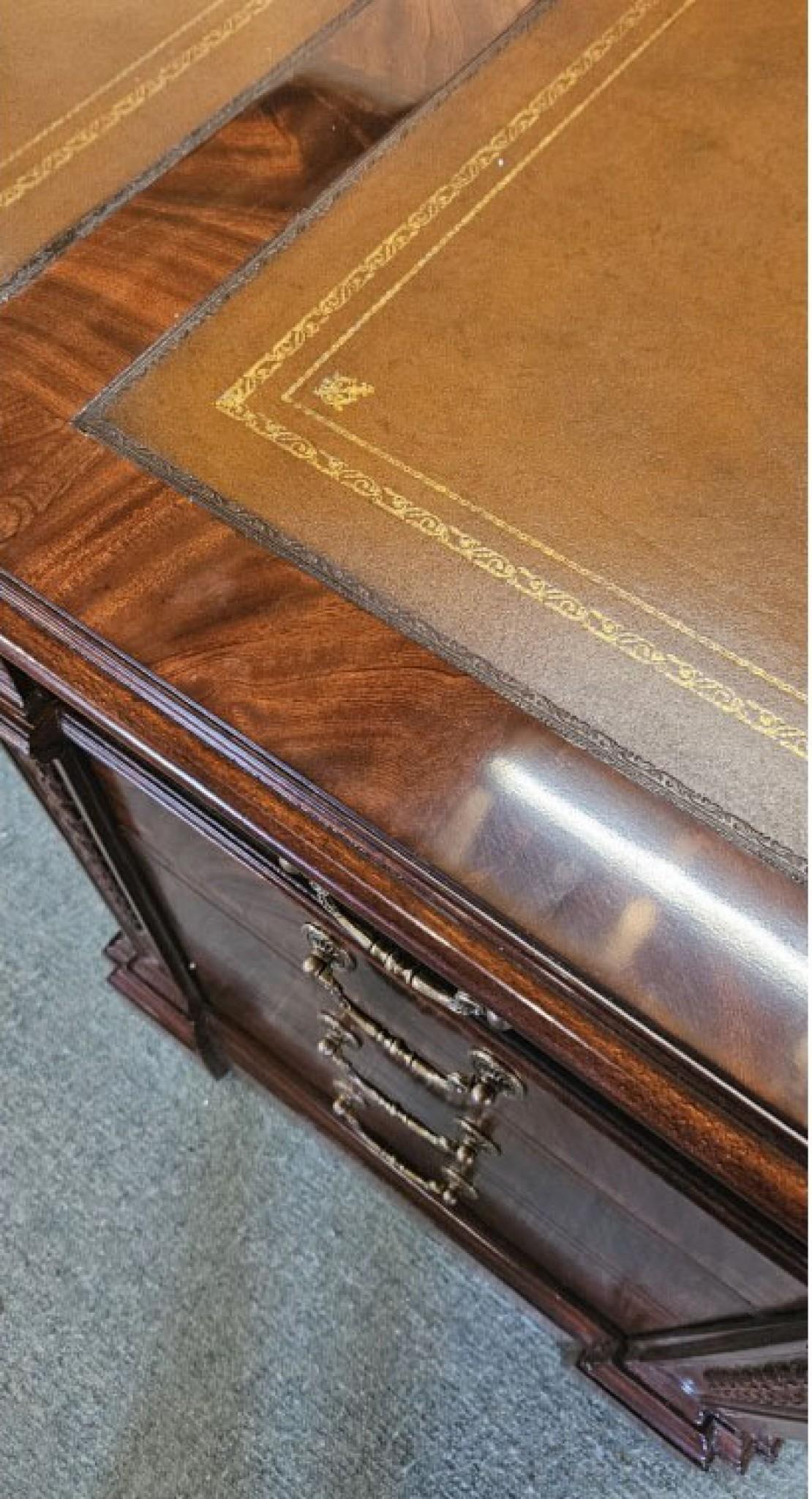 Fantastic large partners desk in the Regency manner
True partners desk with drawers and cupboards on both sides
Hand crafted from mahogany with great patina to the wood
Features solid oak drawer linings and brass drop handle
Good size so perfect for