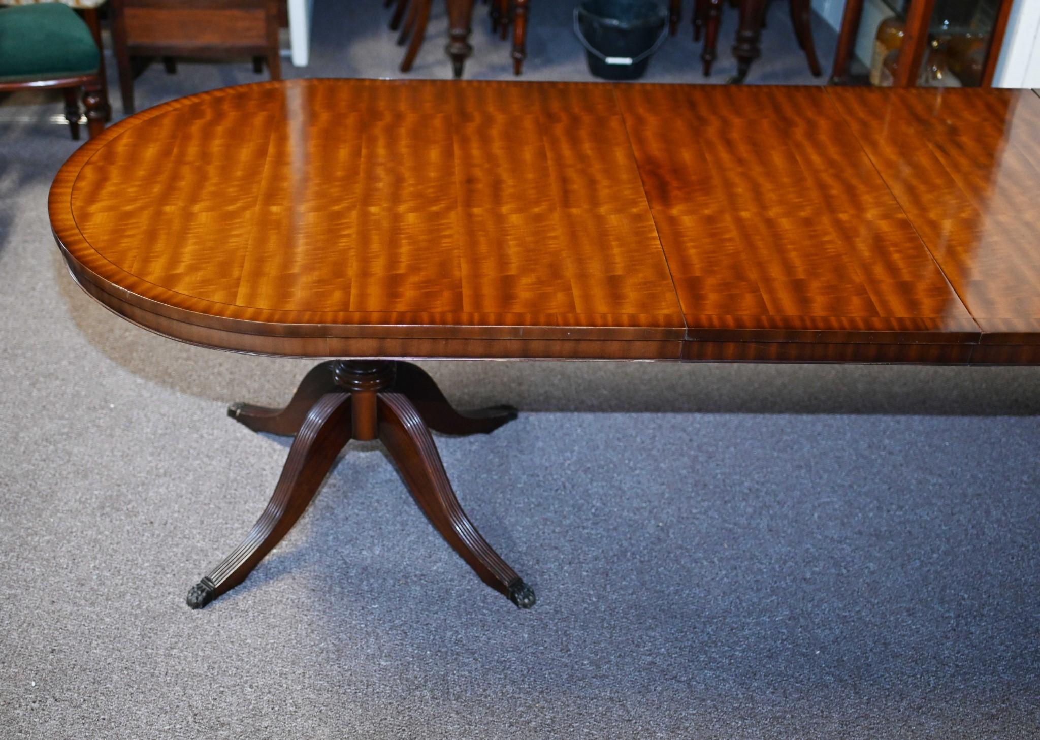 You are viewing a gorgeous Regency style dining table
Comes with a matching set of ten chairs in the Hepplewhite manner
Chairs are two arm chairs and eight side chairs
The chairs are solid and stable, wobble free - just reupholstered with clean