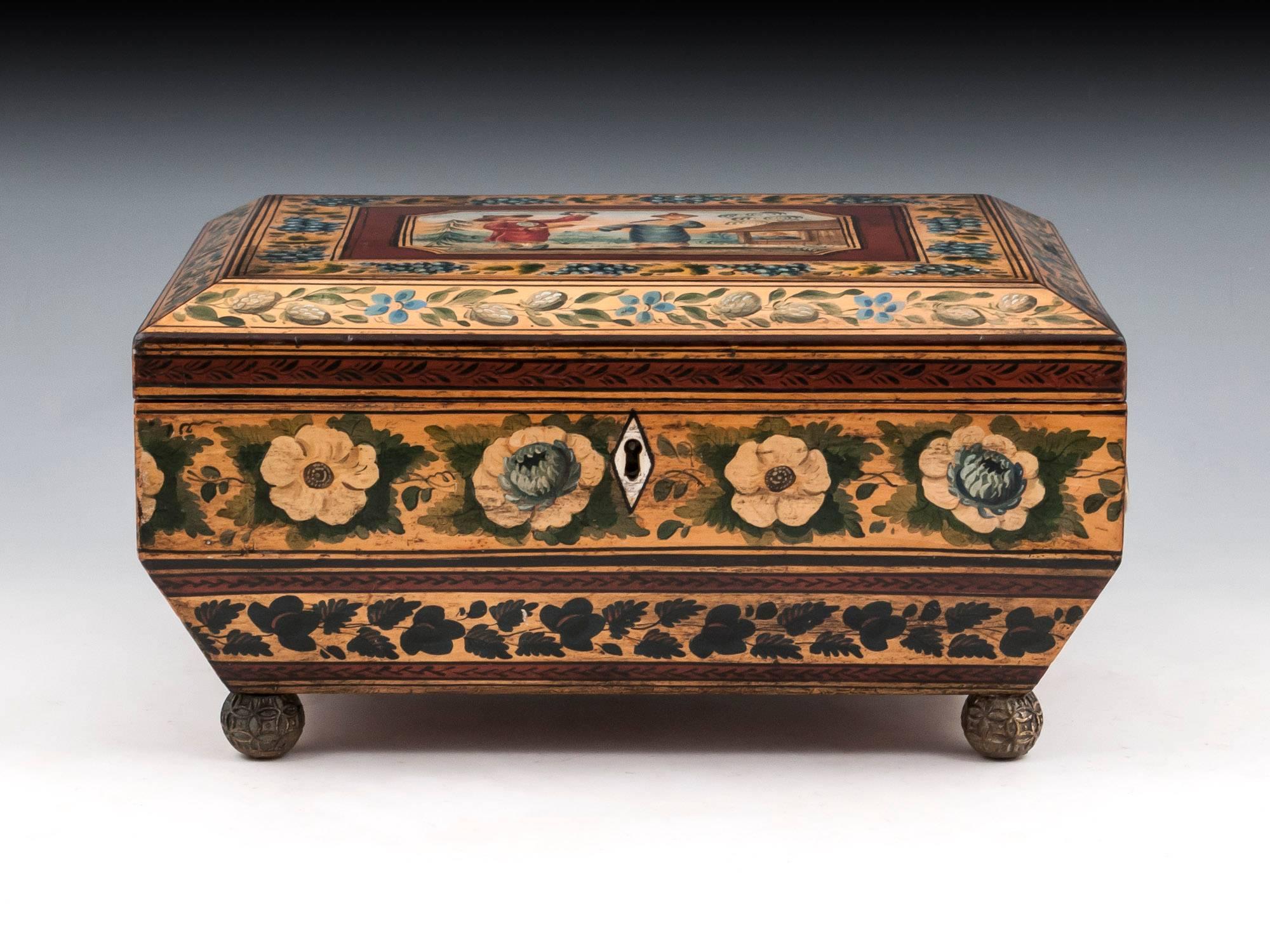 Exquisite penwork chinoiserie sewing box in sycamore, the top decorated with vibrant painted Chinese figures within a pretty grapevine border. The vibrant colours continue on all sides with more fruit and flowers. Lifting the lid of this penwork