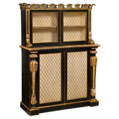 Meuble bibliothèque peint en noir et doré, époque Régence, 19ème siècle