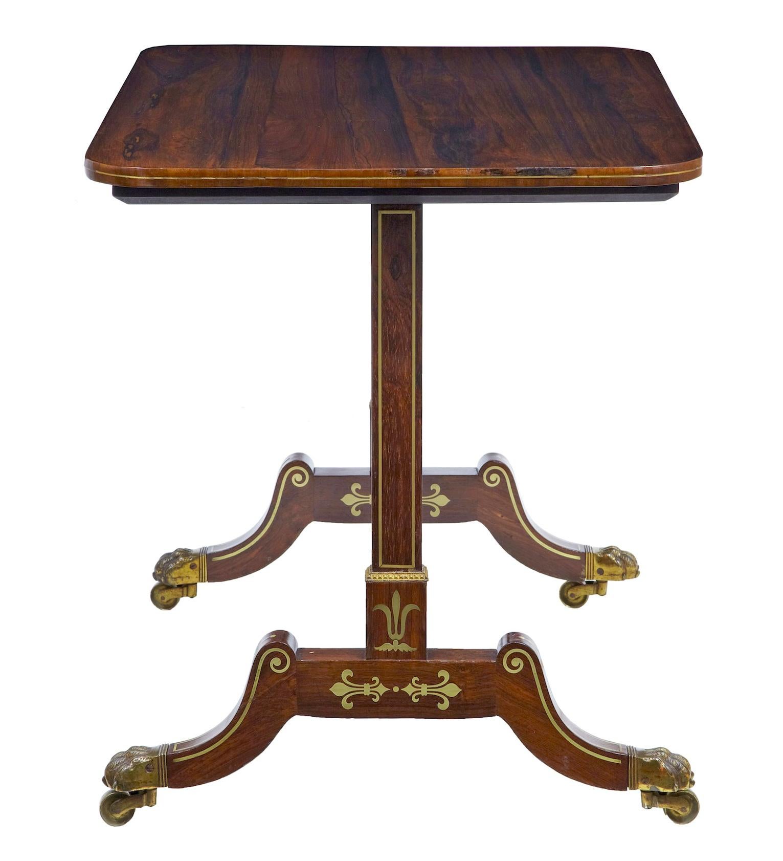 Regency period brass inlaid palisander occasional side table, circa 1820.

Top quality table in good condition. Ideal for use as a side or sofa table.

Rectangular top with rounded edge with brass stringing detail. Straight supports with inlaid