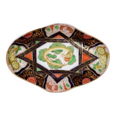 Piatto in porcellana Coalport Porcelain del periodo Regency con drago giallo e leoni