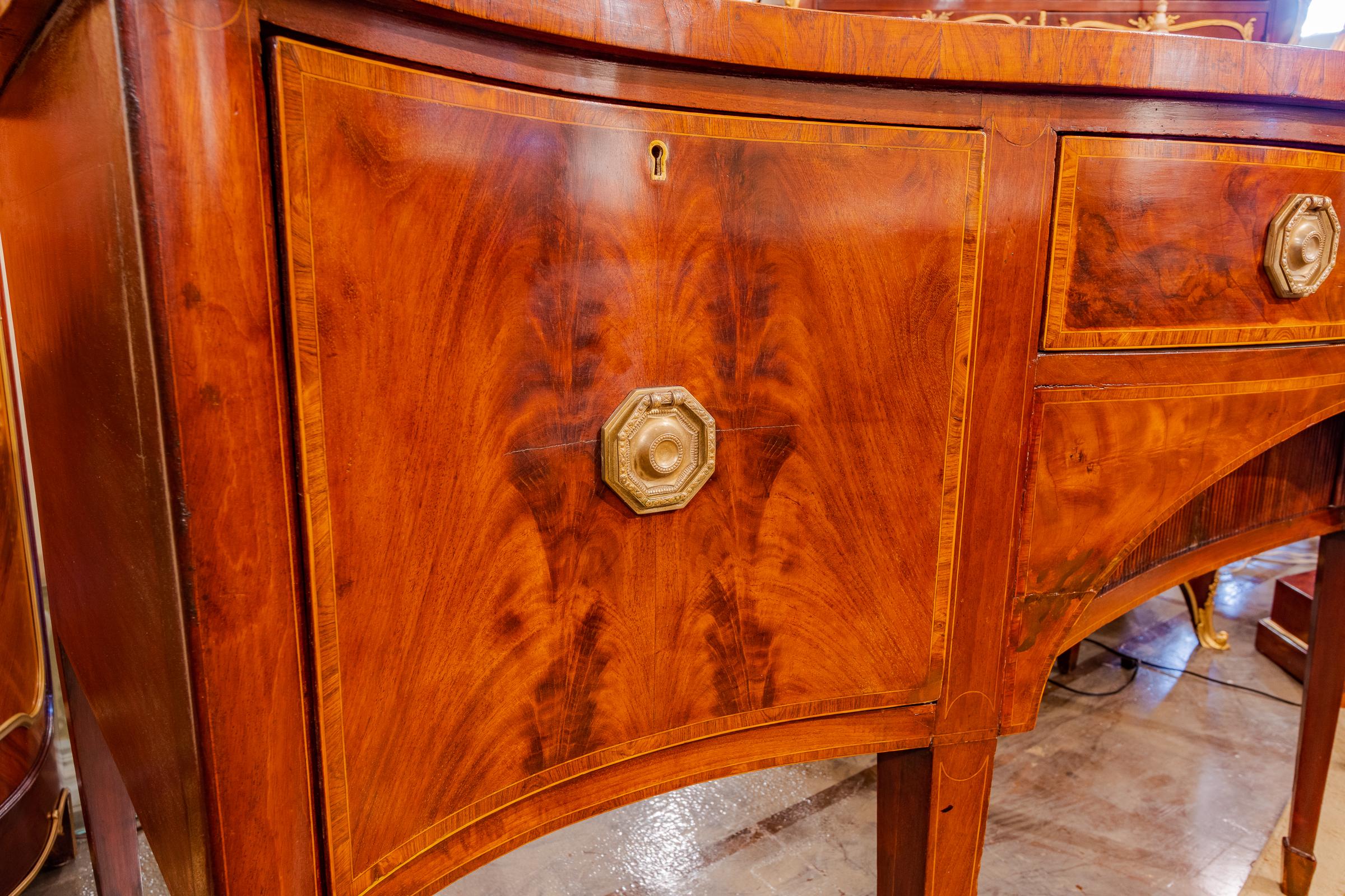 Regency period mahogany and rosewood inlayed sideboard.