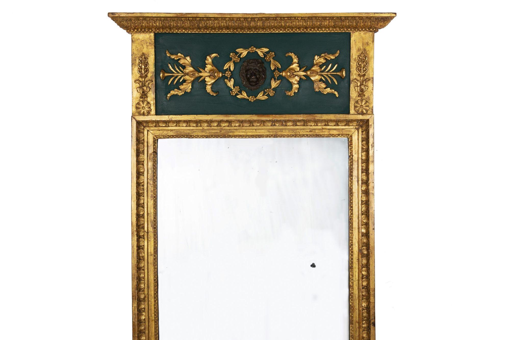 REGENCY PERIOD PARCEL GILDED AND POLYCHROMED PIER MIRROR WITH CARVED LION'S HEAD
Probably England, circa first quarter of the 19th century
Item # 307YEK13A 

A fine early 19th century pier mirror in the Neoclassical taste, it is beautifully