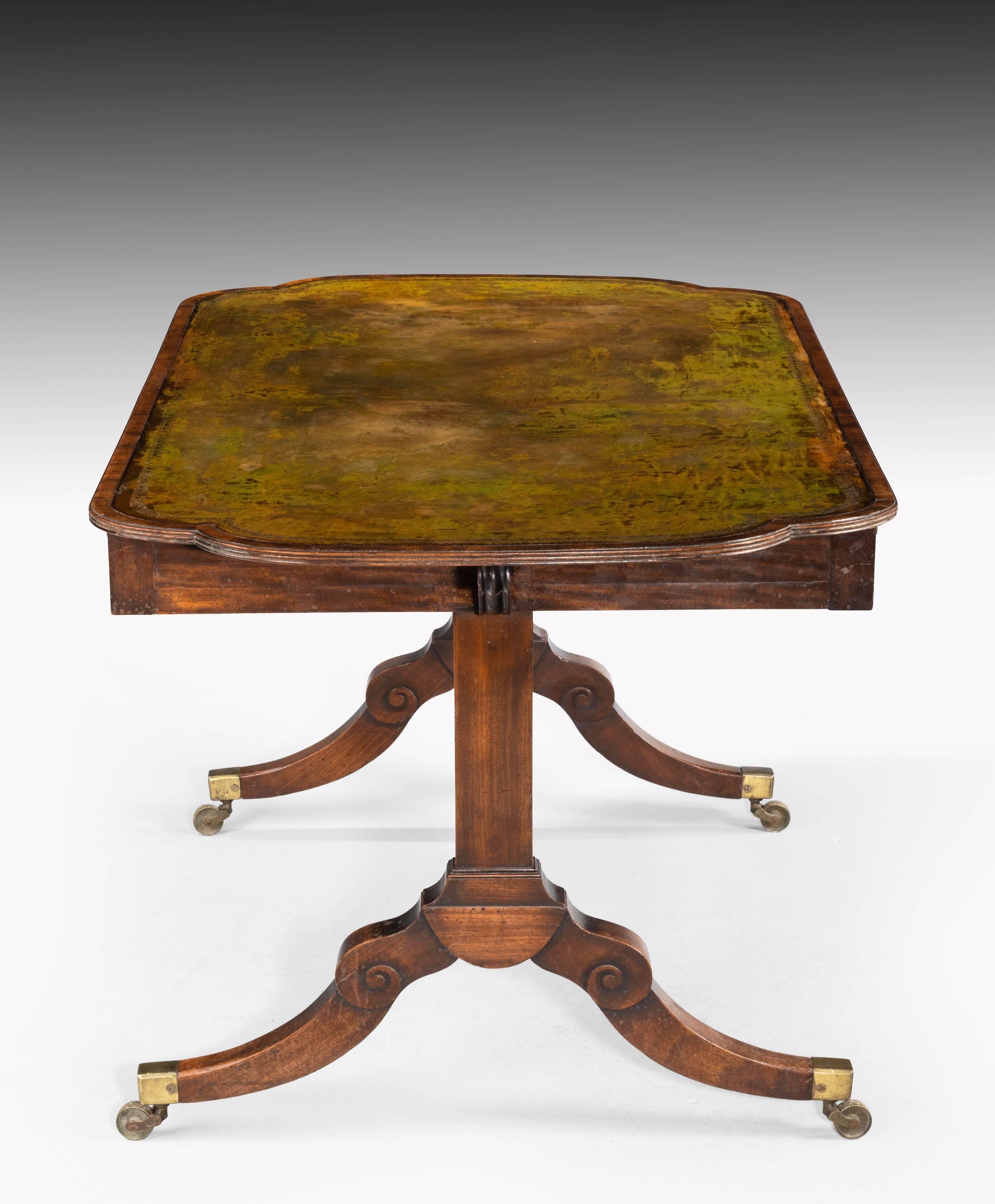 A most unusual Regency period library table with Roman type ends. End supports with a high bowed centre stretcher. Beautiful overall patina and color.
   