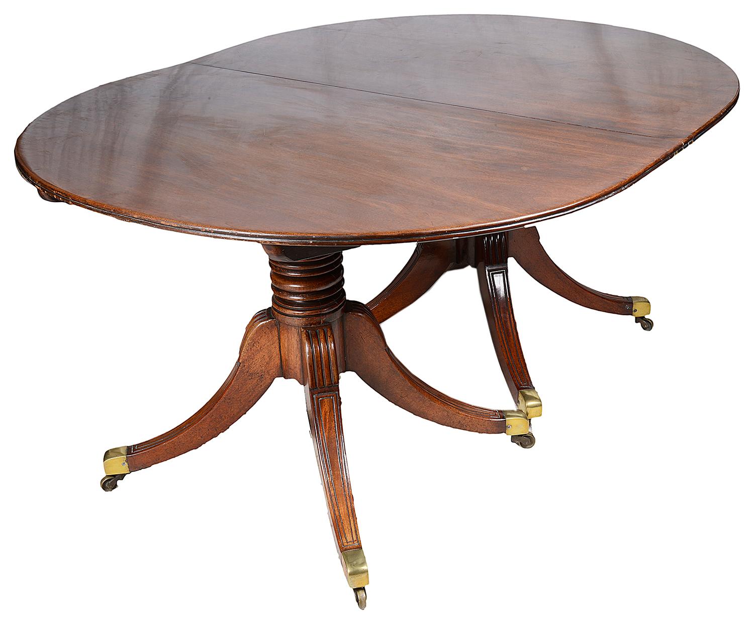 A good quality Regency period mahogany twin pedestal dining table, having two extra leaves allowing a selection of sizes to seat from 4 to 10 people. The bases being reeded four splays terminating in the original brass castors.
Each leaf measures