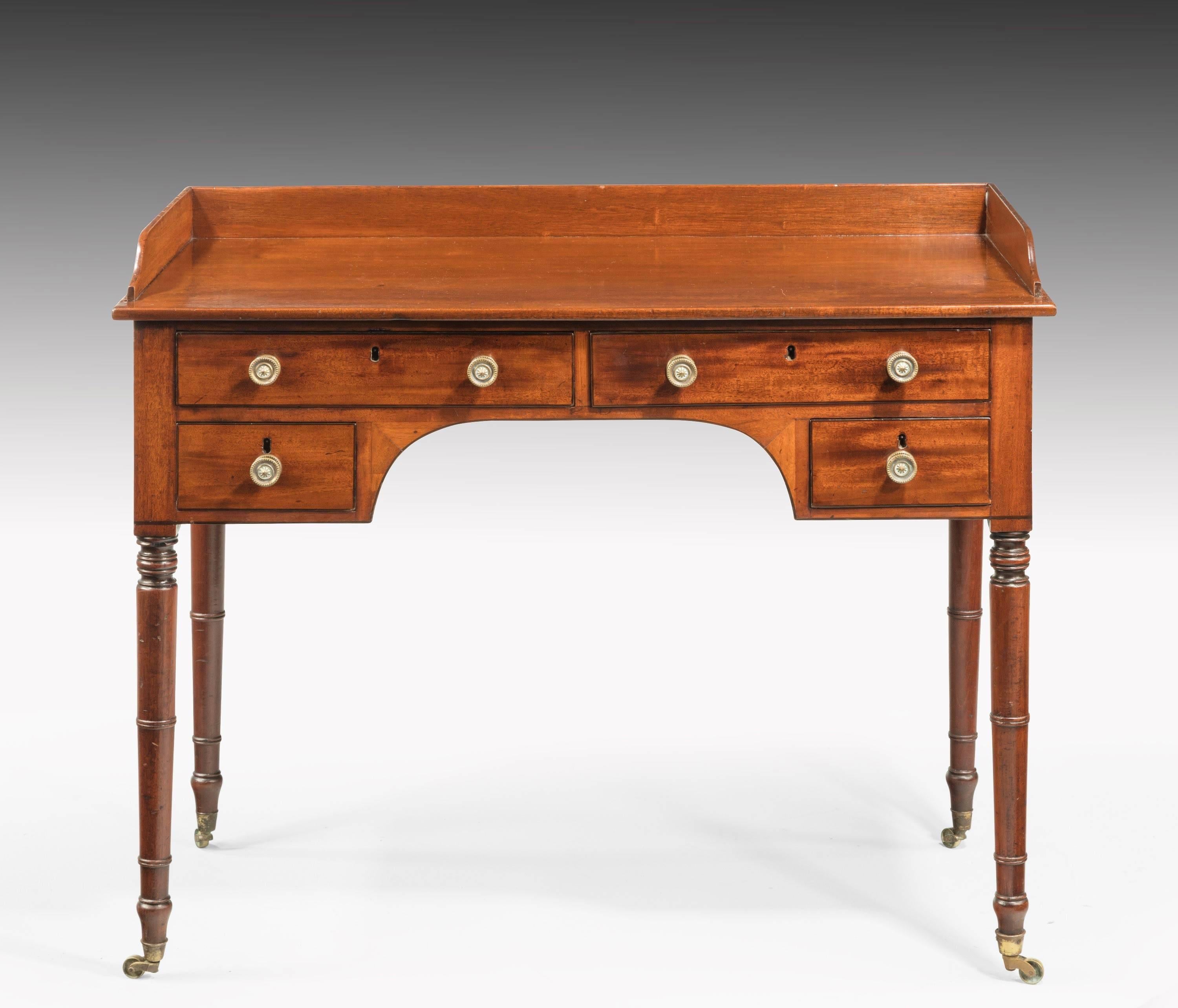A Regency period mahogany side or writing table very much in the style of Gillows of Lancaster.