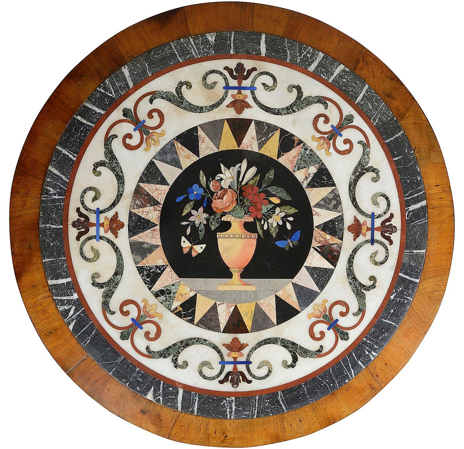 A fine quality and rare Maltese Regency period, Specimen inlaid marble top centre table. Having a classical scrolling foliate and motif banding, multiple inlaid marble triangles to a further boarder, and an urn with flowers + butterflies.
The frieze