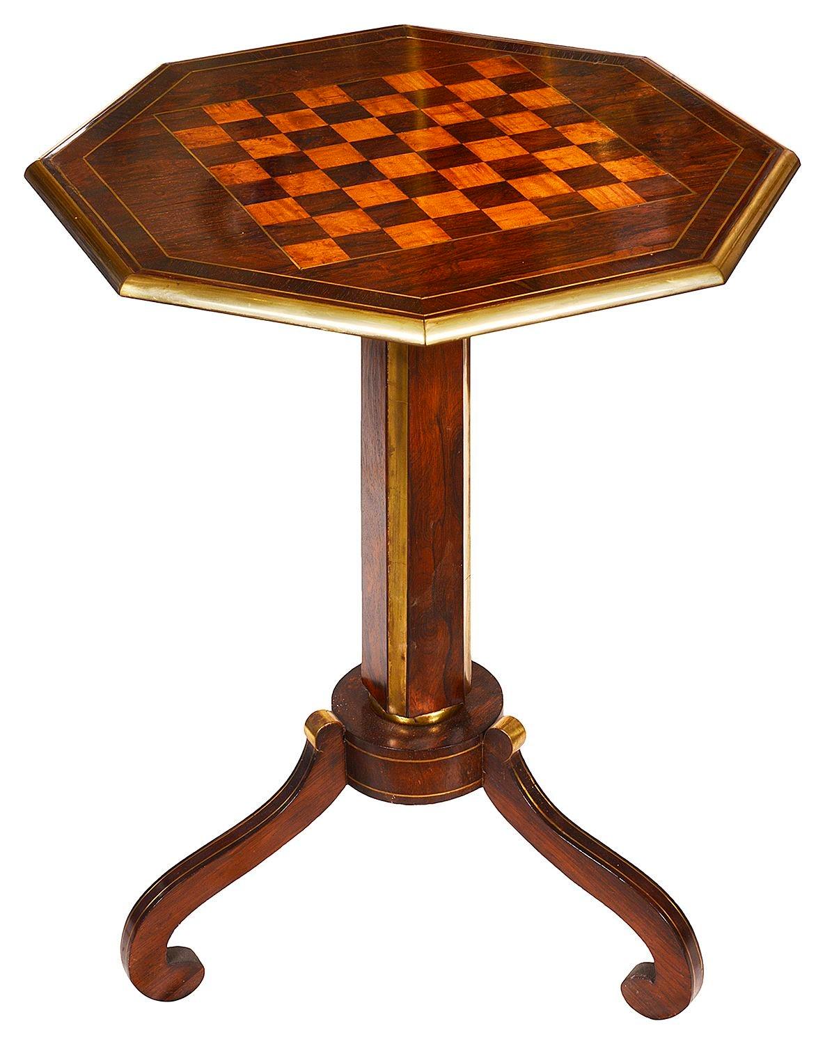 A fine quality Regency period Rosewood and Satinwood inlaid chess table, raised on a square section pedestal with canted brass mounted corners, raised on three elegant scrolling supports.

Batch 71 G9821/22. YNKZ