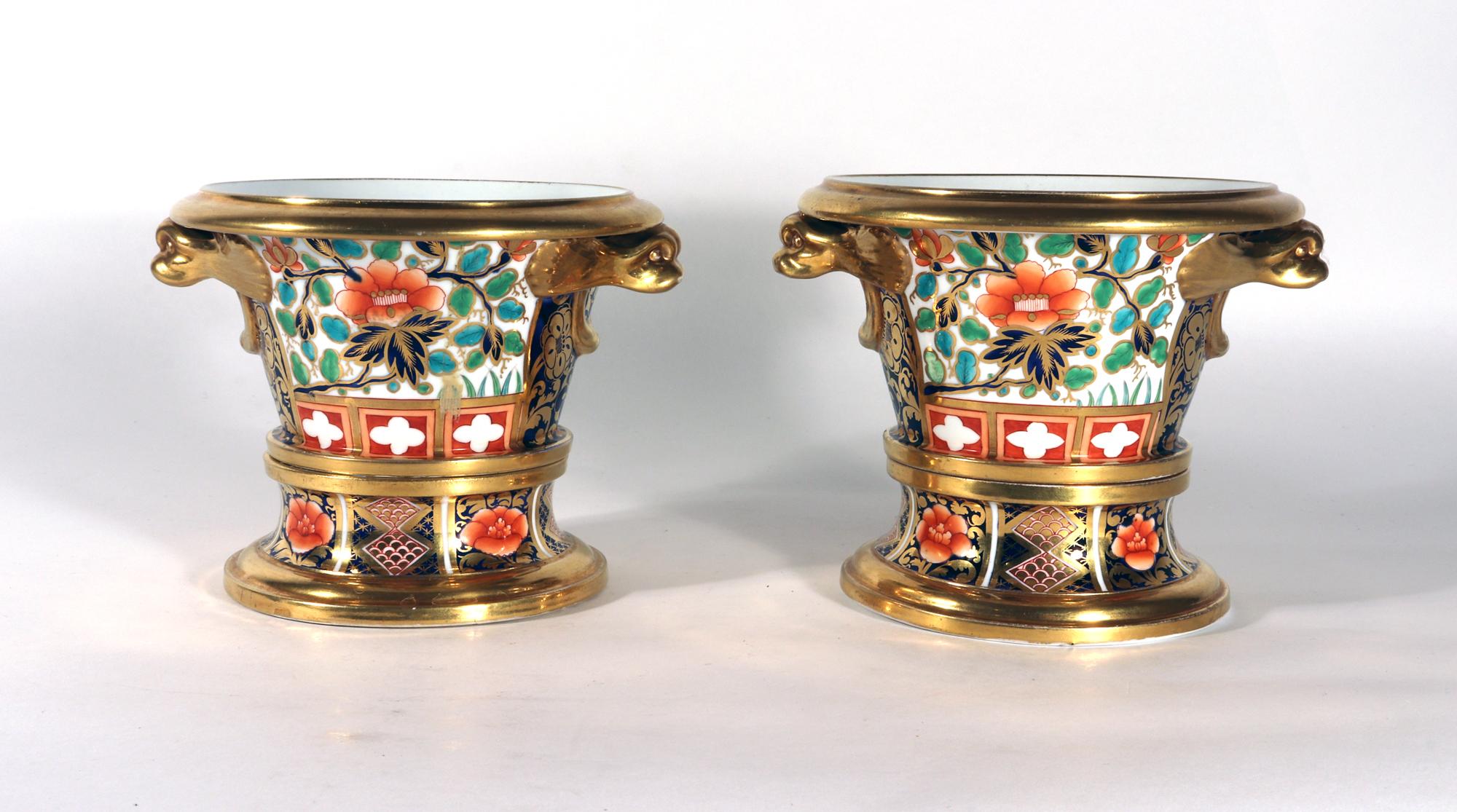 English Regency Porcelain Small Japan-pattern French-form Cache Pots & Stands,
Pattern 1250,
Spode Factory,
Circa 1800-10

The pair of Regency English porcelain cache pots and stands are beautifully painted in Imari coloration also known as