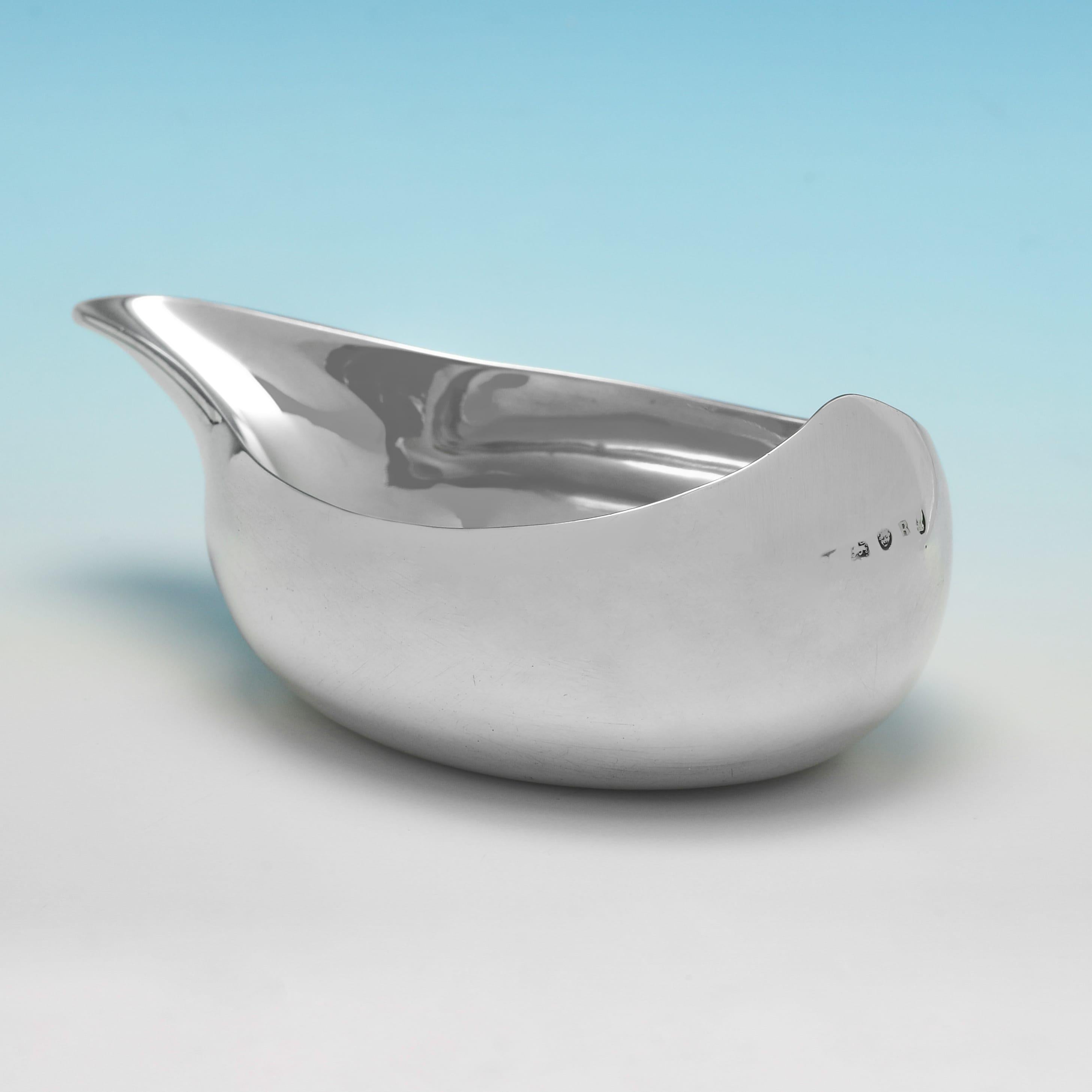 Hallmarked in London in 1812, this simple, Regency period, Antique Sterling Silver Pap Boat, is plain in style, of traditional form, and features reed detailing to the lip. The pap boat measures 4.5