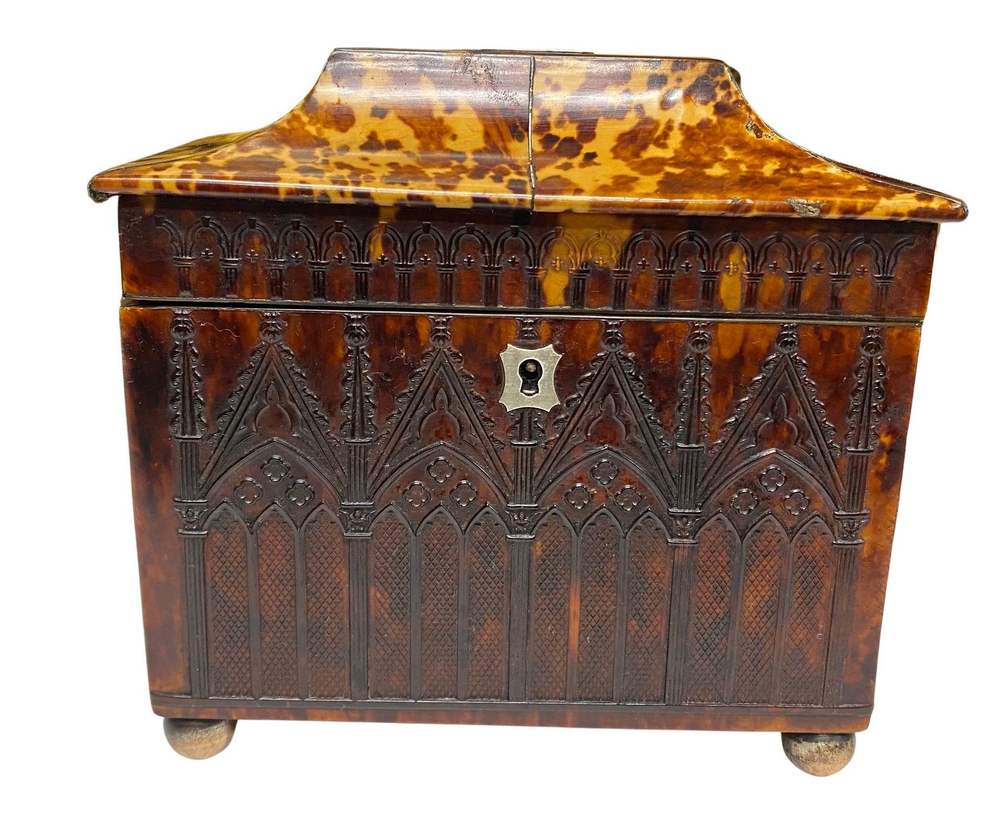 A rare and impressive Regency period Gothic influenced Tortoiseshell tea caddy, having wonderful embossed decoration to all four side and a pagoda style lid, opening to reveal two lidded compartments.