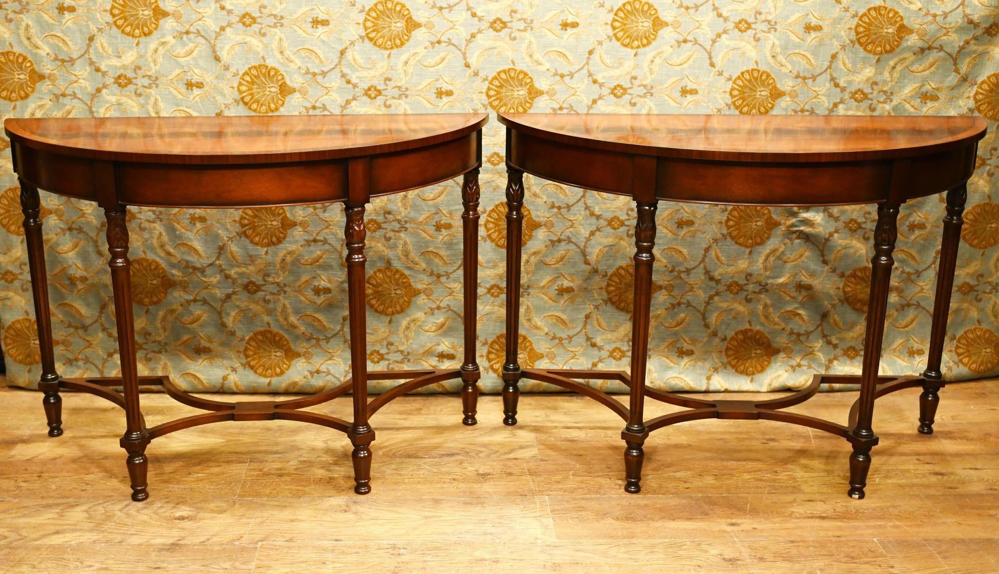 Pair of stylish Regency revival console tables in mahogany
Features an intricately designed stretcher base
Sumptuous mahogany has a lovely patina
Demi lune - half moon - form in the classic style
We can split the pair up if you just require a single