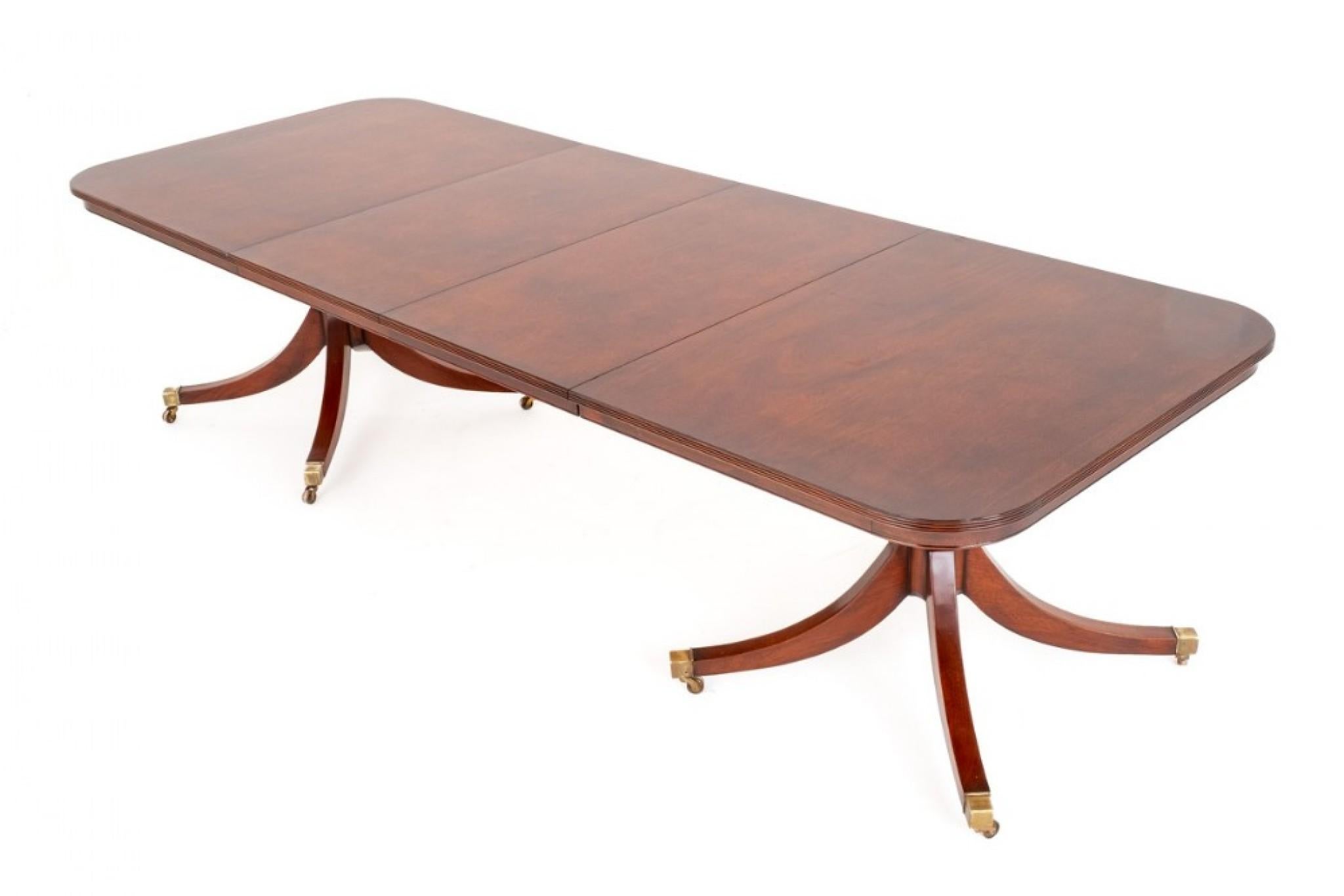 Mahogany Regency Style 2 Leaf Extending Dining Table.
Please scroll through for more pix - this ships anywhere, please get in touch 
This Dining Table Stands Upon Elegant Bases Which Comprises of 4 Reeded Swept Legs With Square Box Brass Castors.