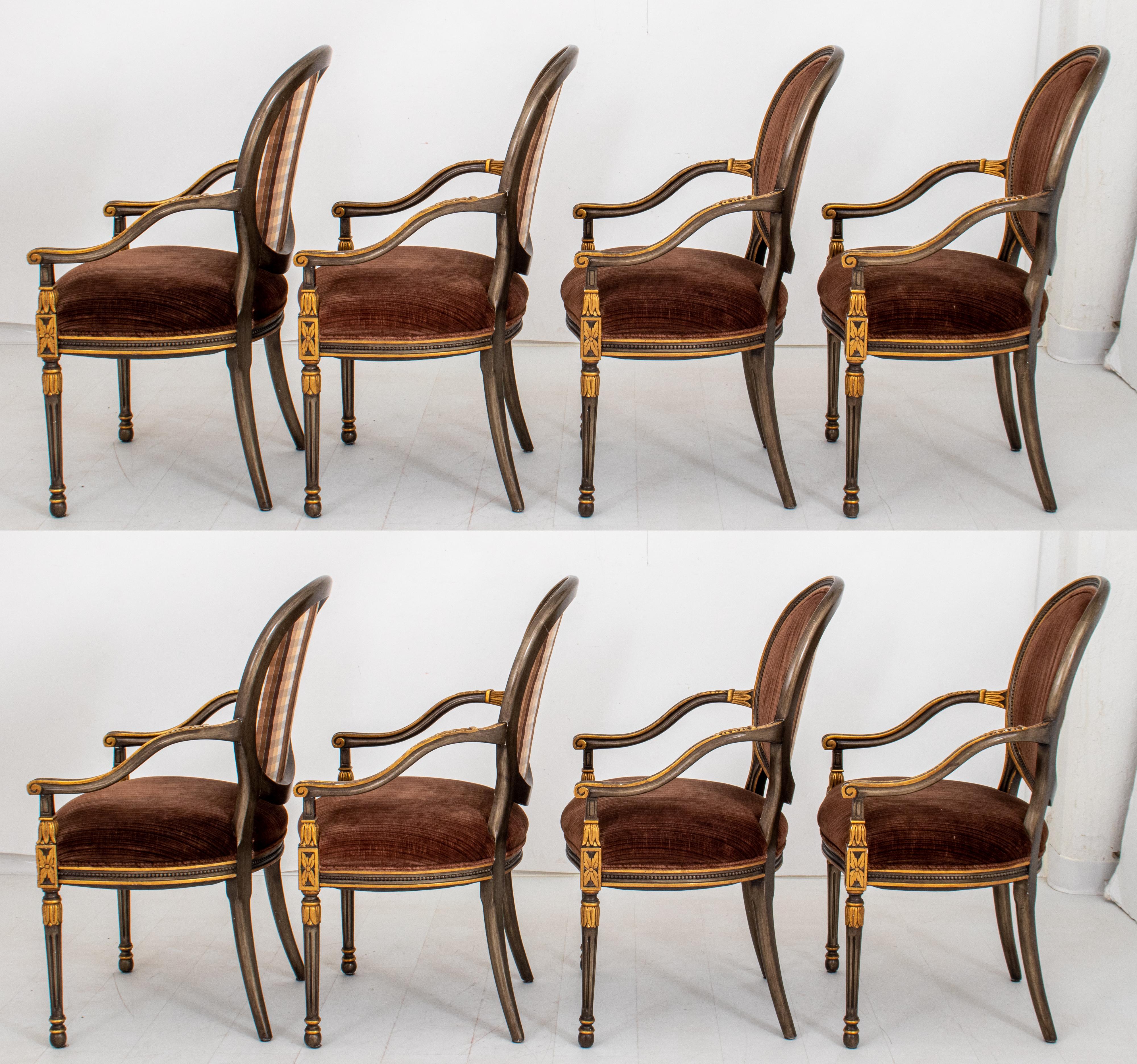 Set of eight Regency Revival dining chairs, the gilt wood arms with carved foliate designs, the ovoid backs and seats upholstered in brown velvet.

Dimensions: 40