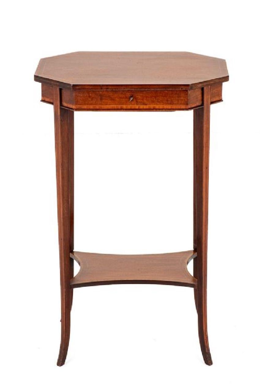 Sheraton Revival Mahogany Sewing Table.
Circa 1880
This Elegant Sewing Table Stands Upon Shaped Legs with a Shaped Under-tray.
The Top of the Table Being of a Shaped Form with Satinwood Cross-banding and Boxwood Line Inlays.
The Interior Having