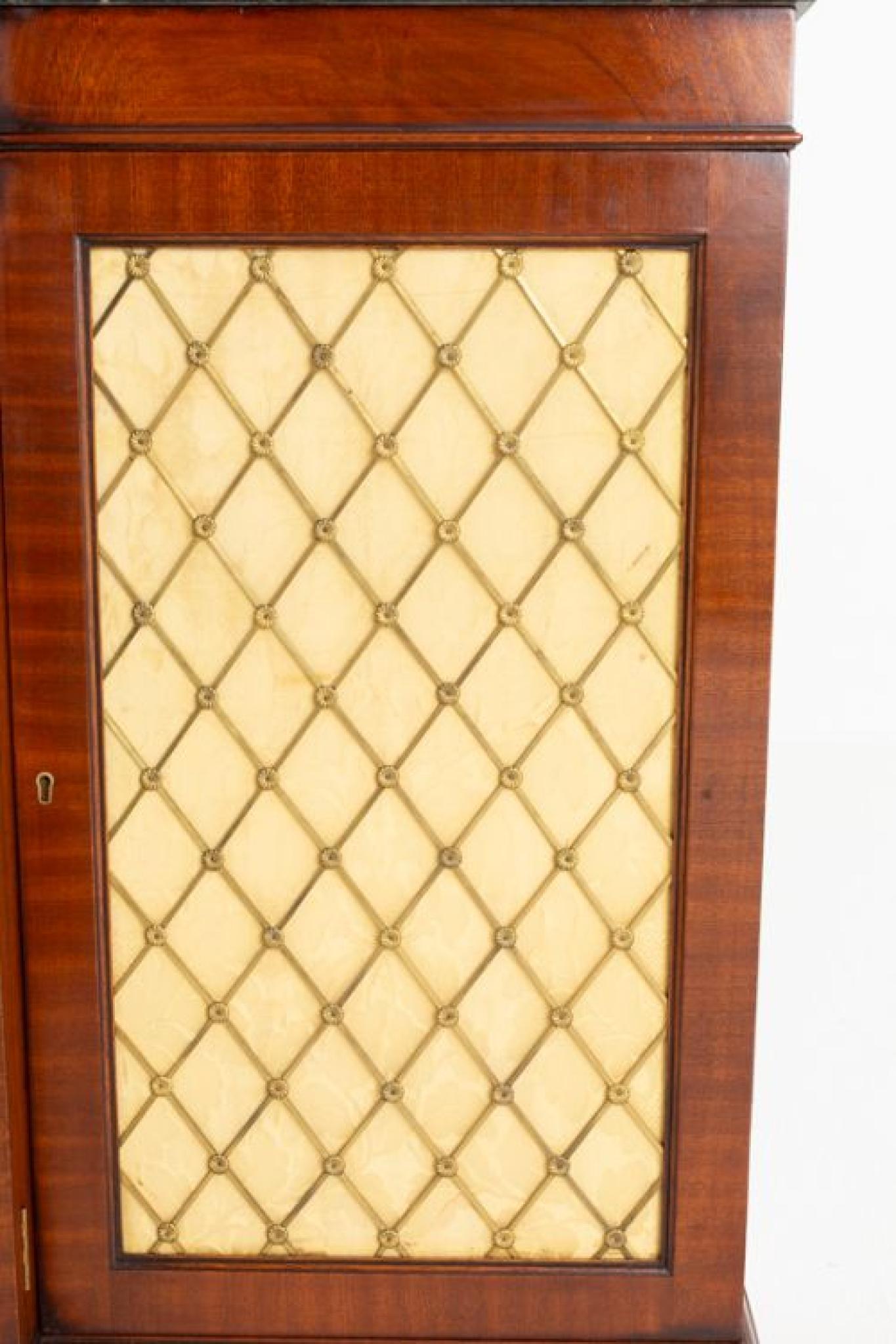 Regency Revival mahogany side cabinet or sideboard
This side cabinet is of a breakfront form
Circa 1920
The centre doors having wonderful flame mahogany panels
These doors are flanked by doors which feature stylish brass grills
The side cabinet is