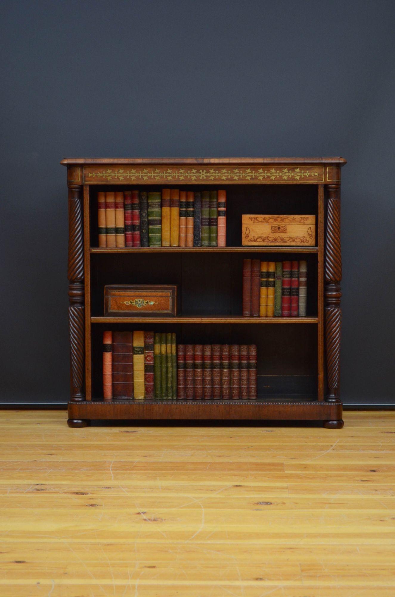 Sn5443 Fine quality and very attractive English Regency open bookcase in rosewood, having moulded top above brass inlaid frieze and two height adjustable shelves, flanked by twisted and ringed columns, all standing on plinth base with beaded edge