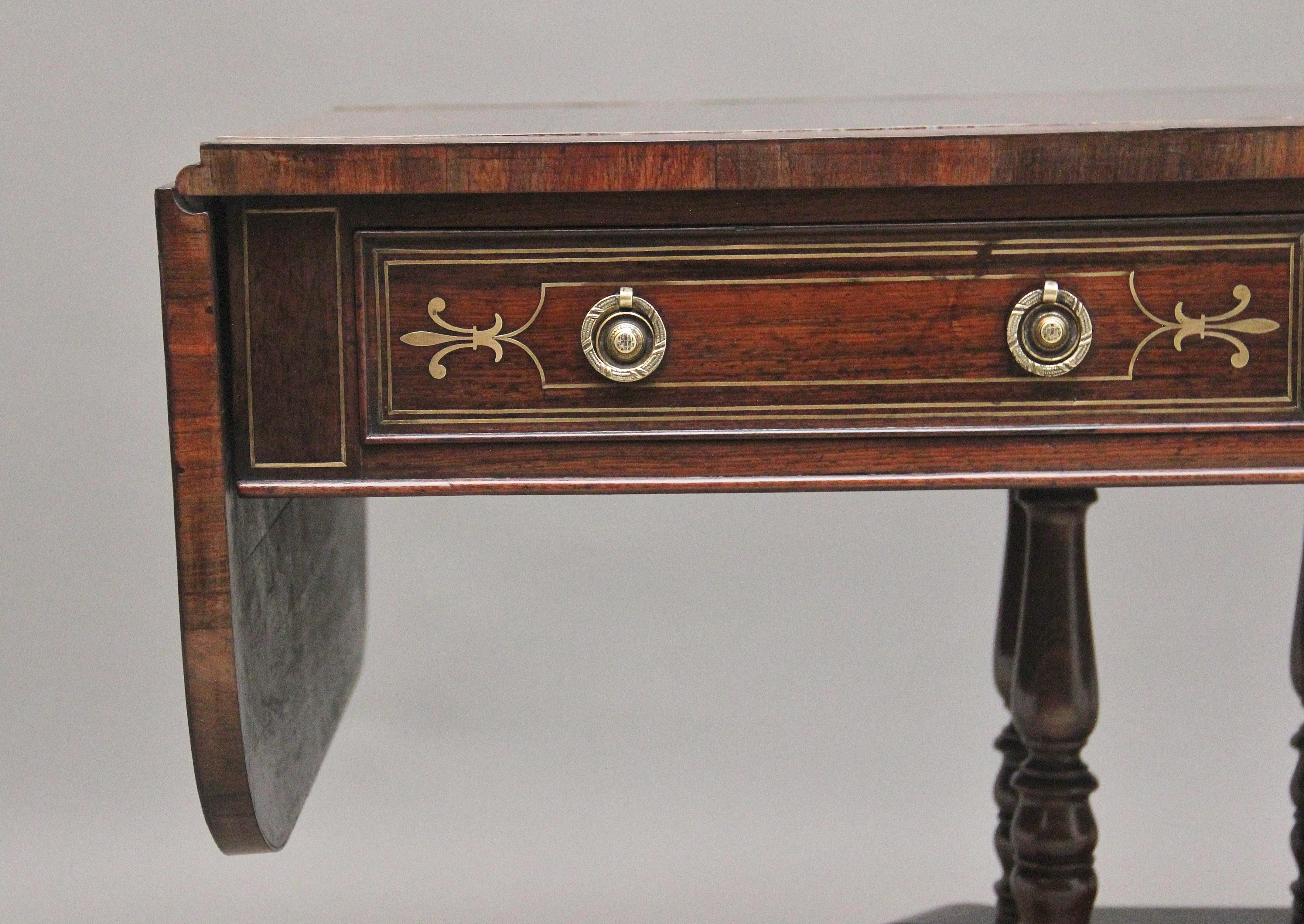 British Regency rosewood and brass inlaid sofa table For Sale