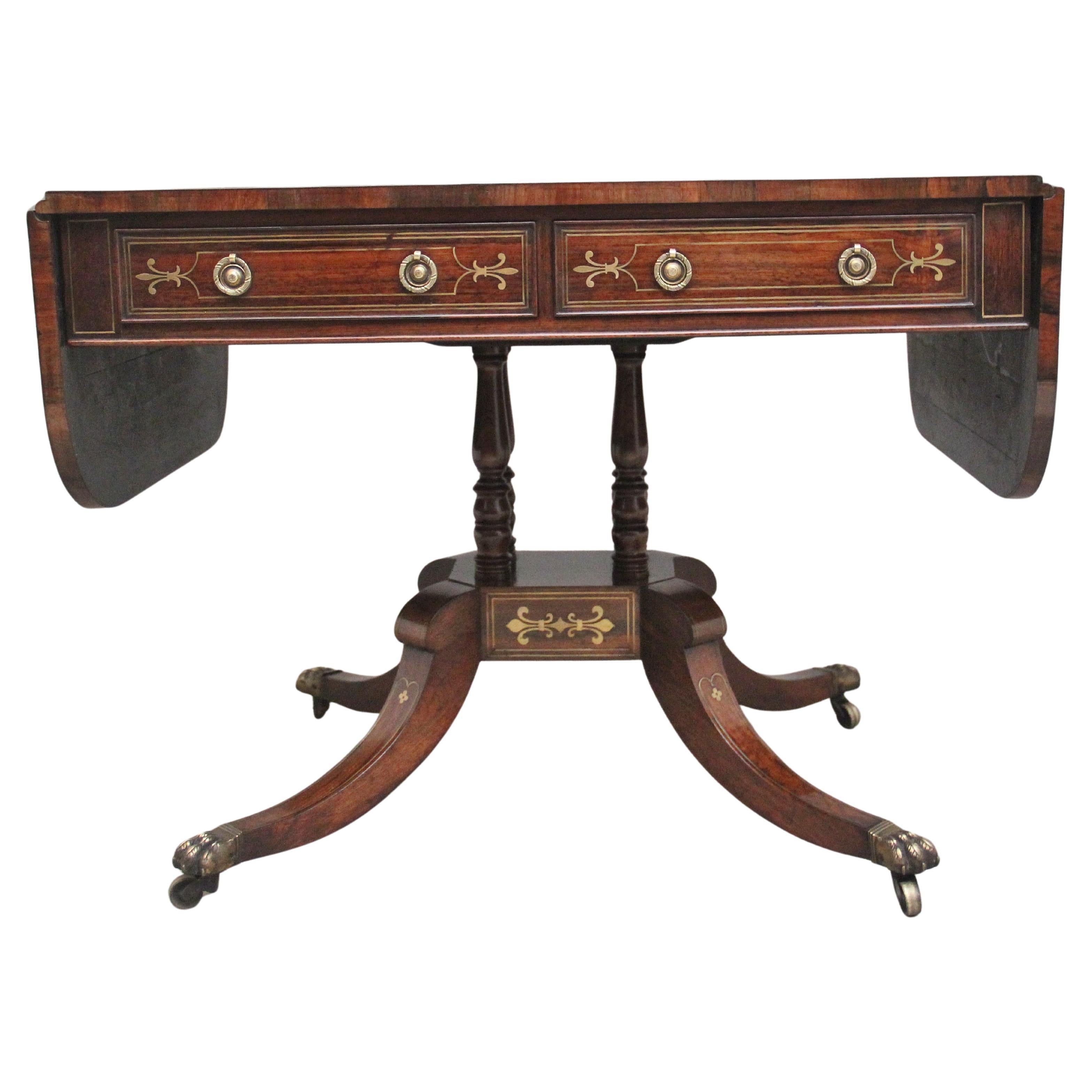 Regency rosewood and brass inlaid sofa table For Sale