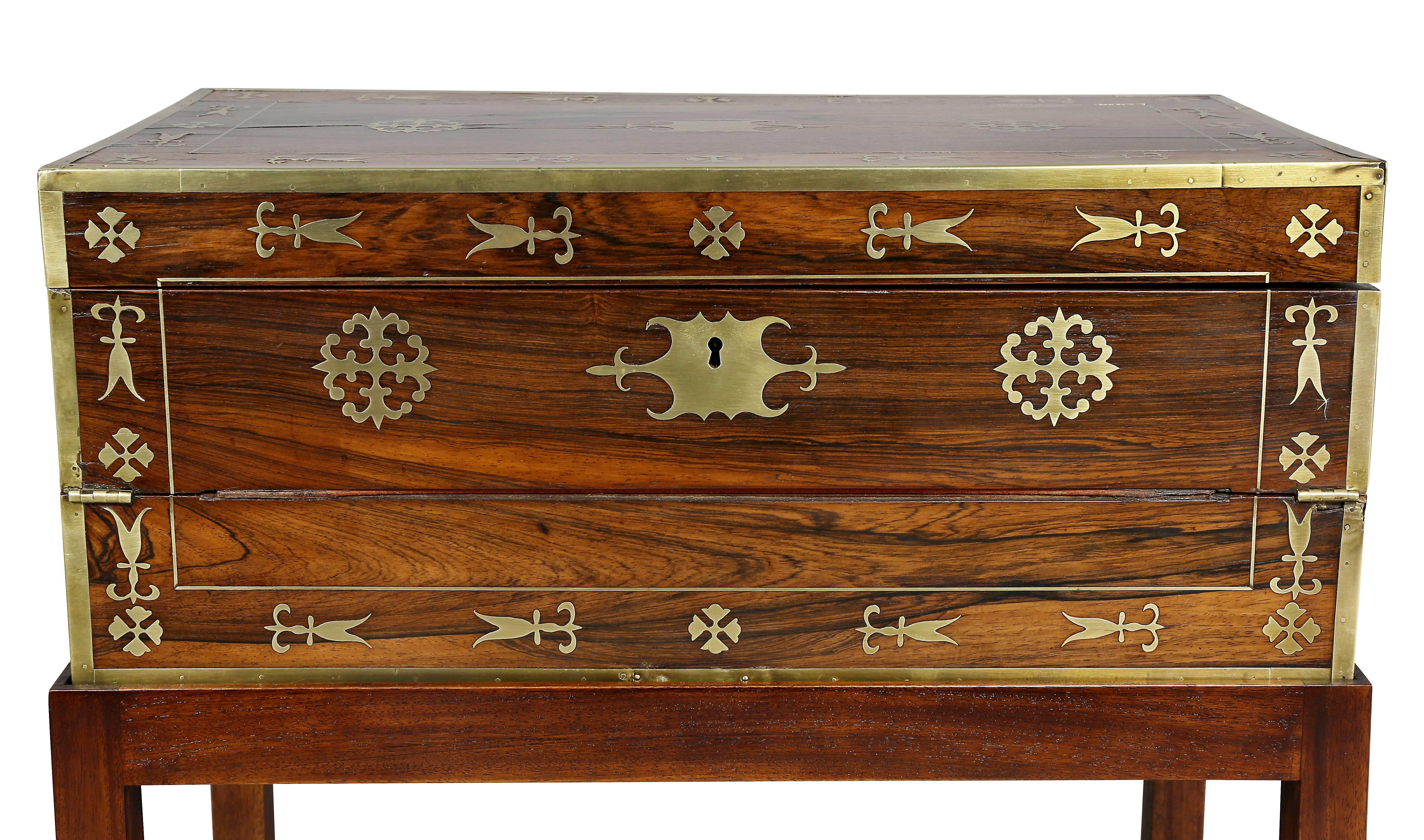 Rectangular hinged top with overall brass inlays with drawer on side, opening to a fitted interior, raised on a later mahogany base.