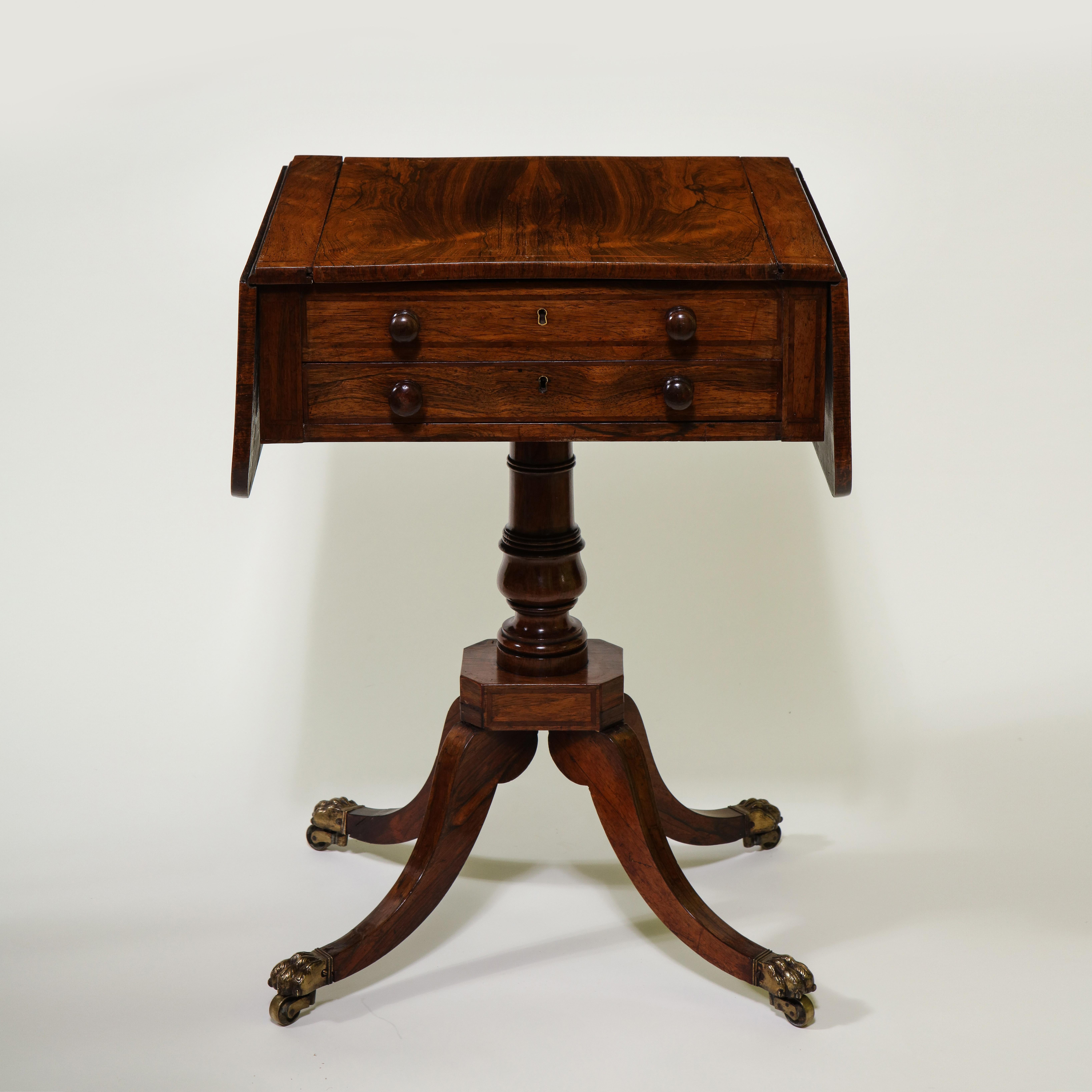 The rectangular top with rounded drop leaves fitted with a reversible sliding panel inlaid with a checkerboard to the reverse and revealing a leather-lined backgammon well to the interior; raised on a pedestal support issuing downswept legs