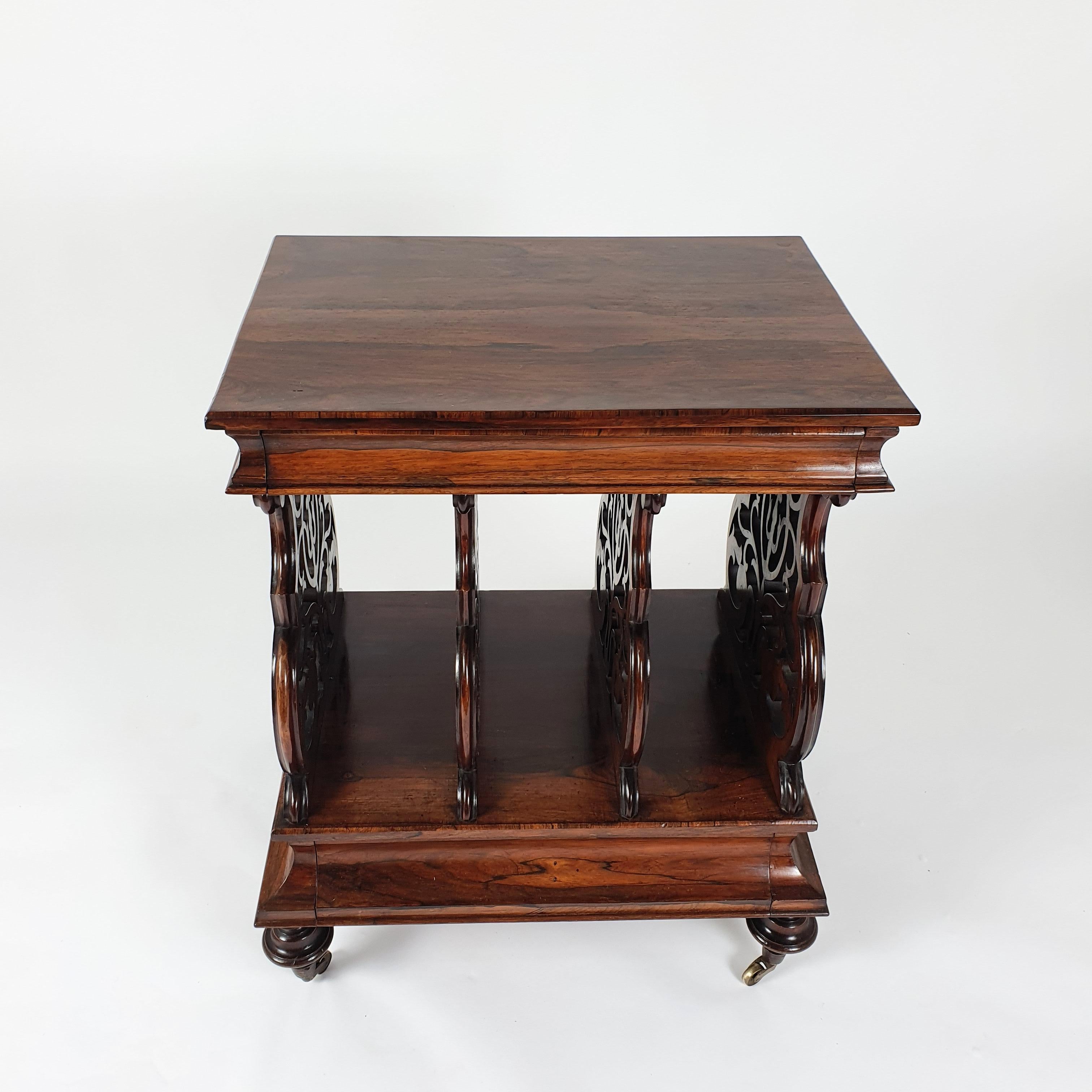 This splendid and very unusual design Regency rosewood Canterbury is attributed to Gillows and features the original brass castors. The Canterbury has a very attractive ‘X’ frame series of divisions with a single drawer below.
It measures 20 in,