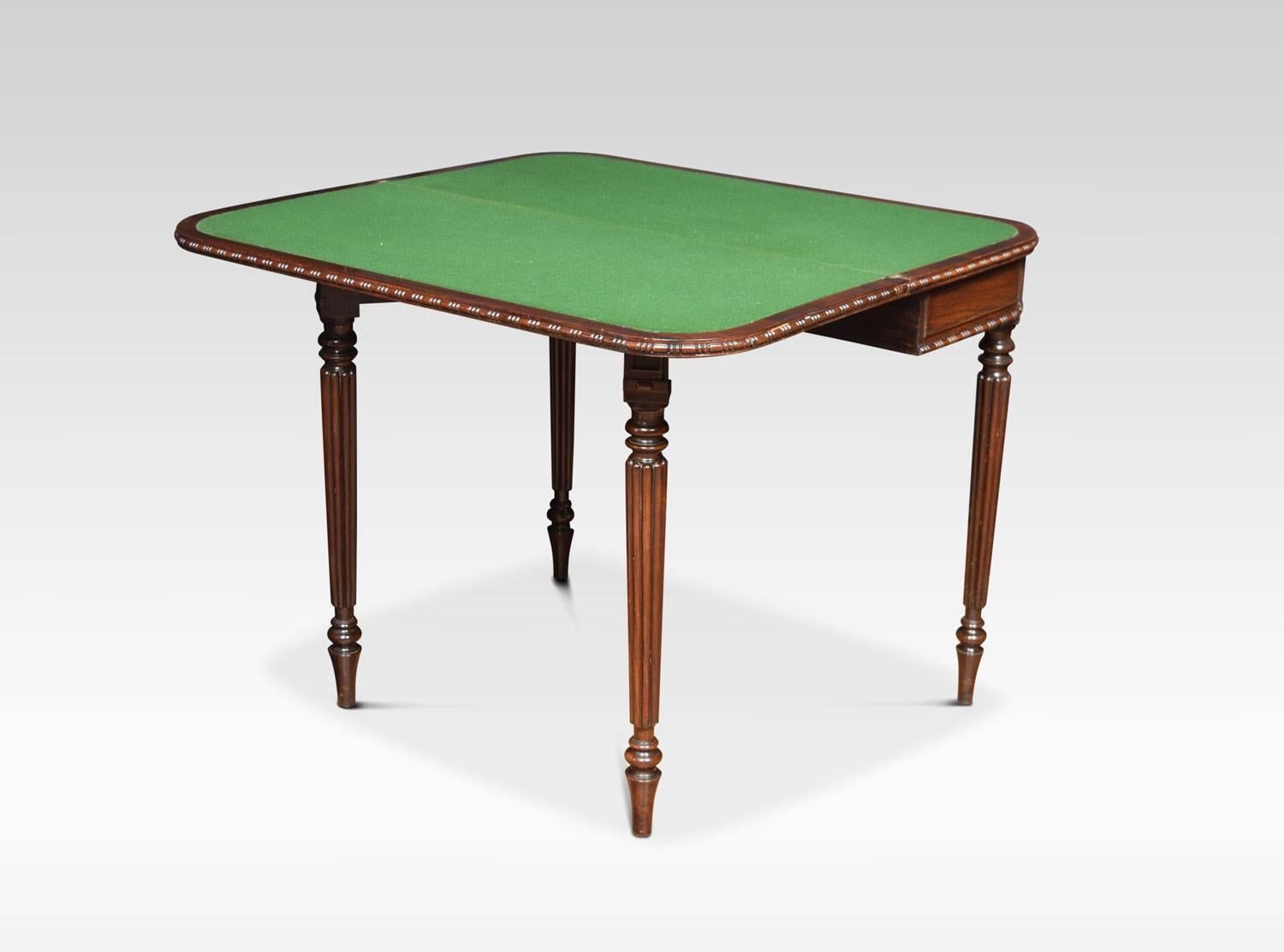 Regency card table, the well figured folding and swivel rosewood top opening to reveal inset baize interior. To the moulded freeze, all raised up on four reeded turned tapering legs.
Dimensions:
Height 29.5 inches
Width 36 inches
Depth 17 inches.
