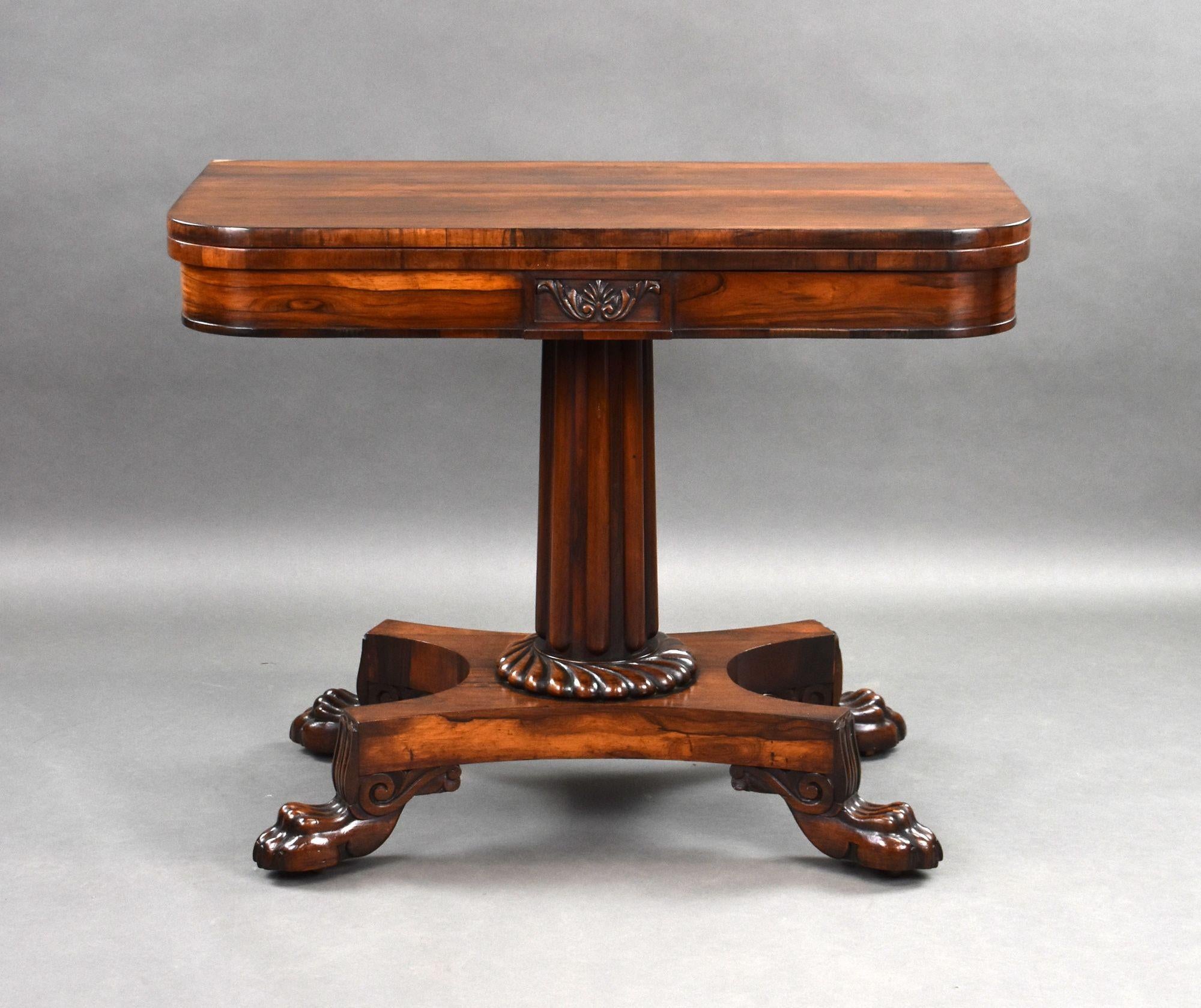 For sale is a good quality Regency rosewood card table in the manner of Gillows. Having a well figured top, swiveling and folding over to reveal a green baise, above a reeded stem, over a platform base raised on carved paw feet. This piece remains