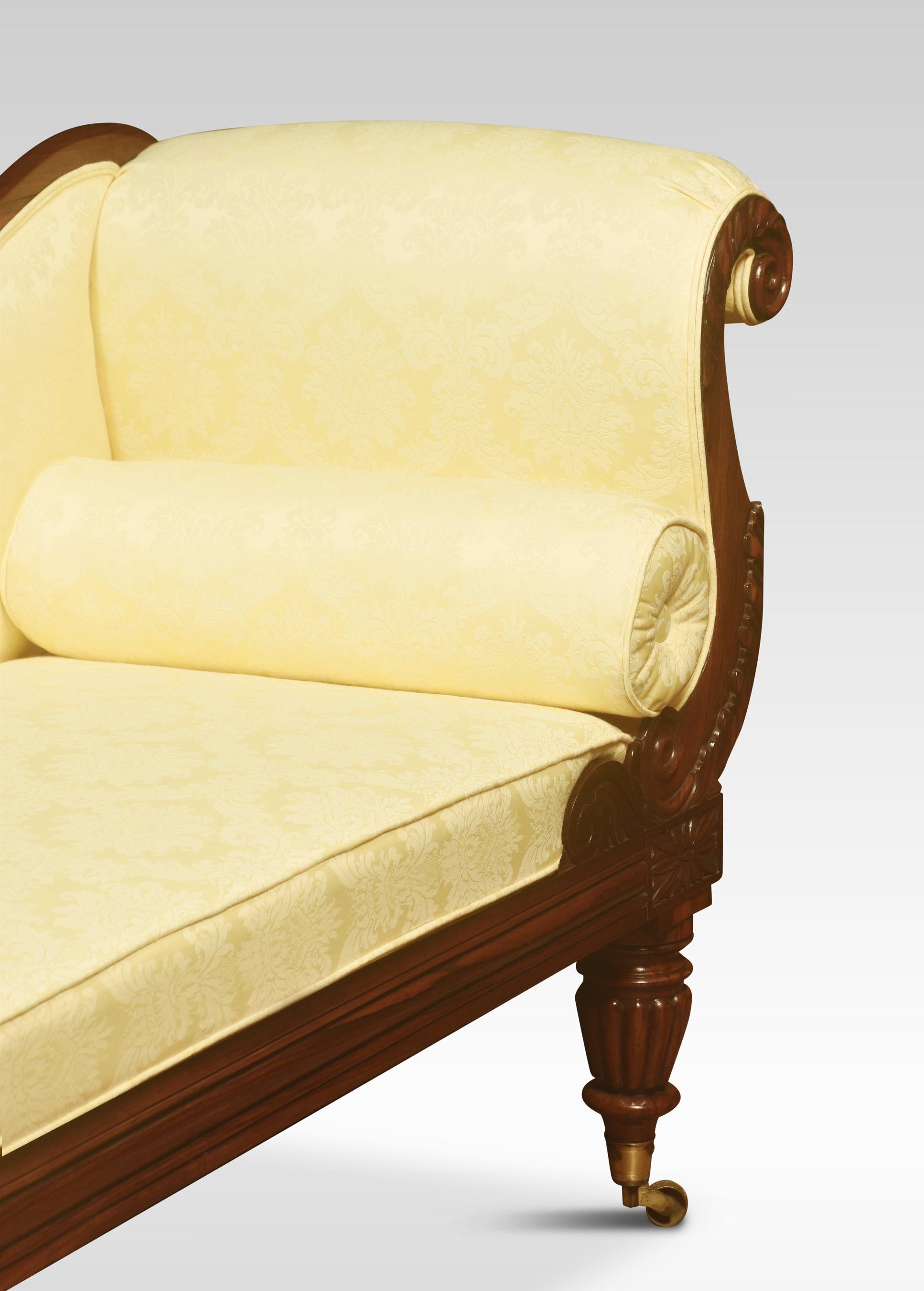 Egency rosewood chaise lounge, the carved backback rail which can be removed or used on either side, to the scroll arm and loose cushion seat, raised on conforming reeded turned legs terminating in brass caps and castors.
Dimensions
Height 36