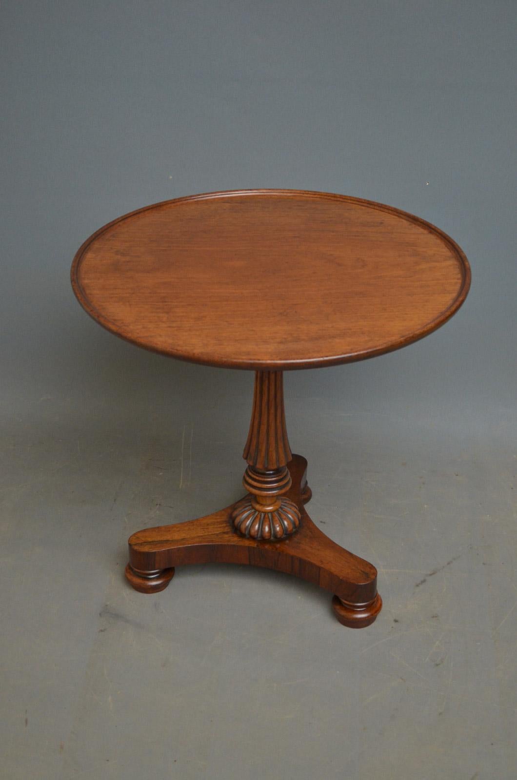 K0376, elegant Regency coffee table in rosewood with dished top, fluted and ringed column and trefoil base terminating in pad feet. This antique occasional table has been reduced to coffee table height; it retains its original finish, mellow colour