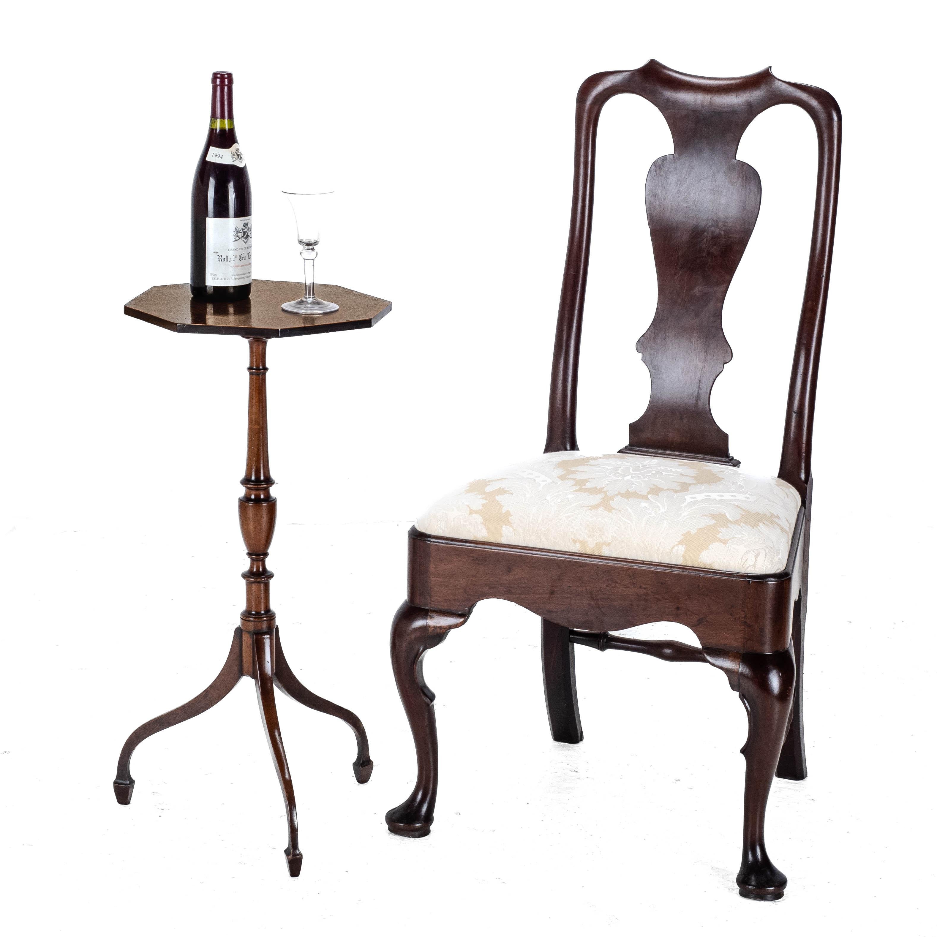 A Regency period, mahogany tripod wine table with rosewood crossbanded border, Circa 1810. This attractive table, features an octagonal shaped top, supported by a fine turned baluster stem, raised on a tripod of down splayed legs on spade feet.

A