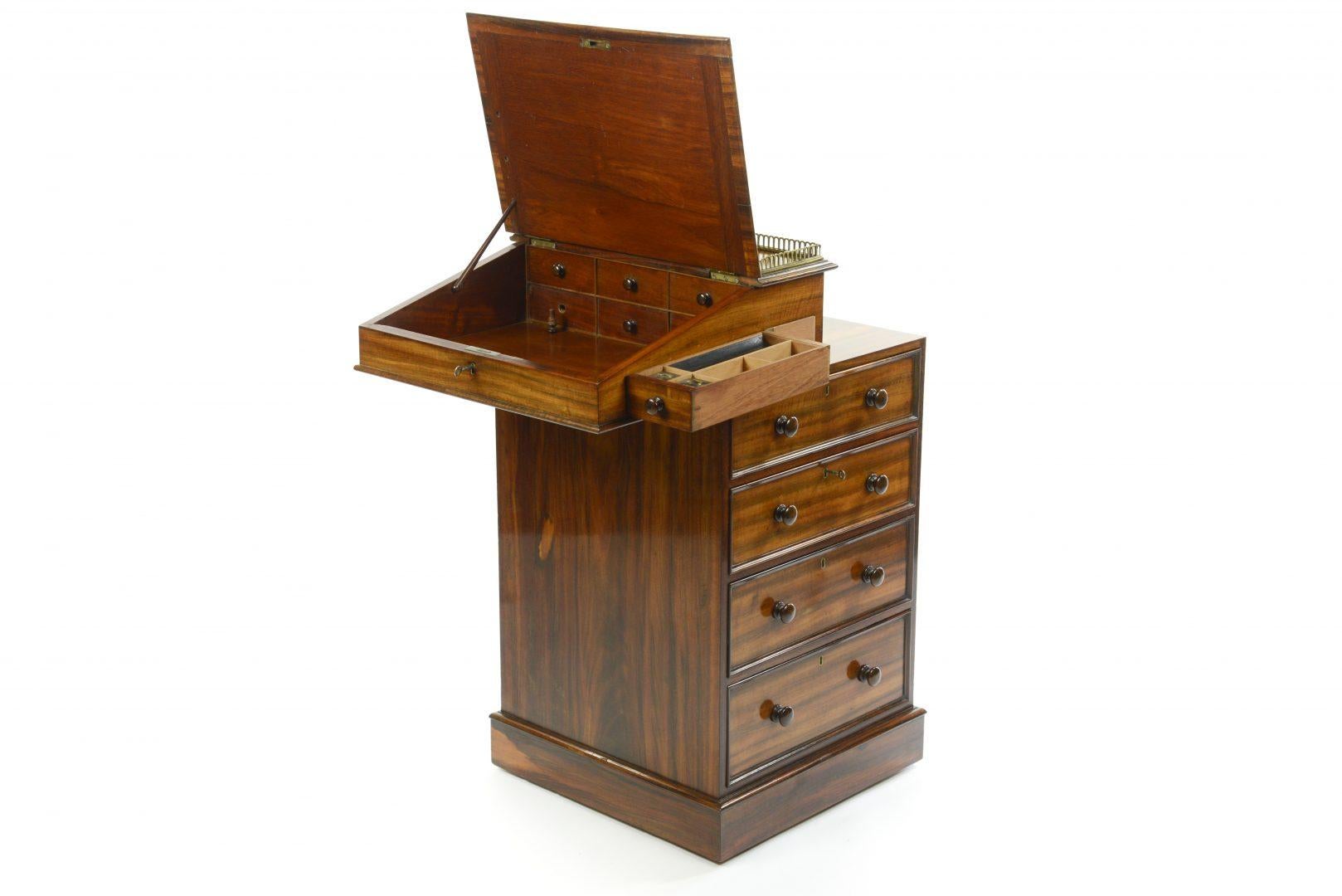 Regency Rosewood Davenport stamped Hindly & Son, late Miles and Edwards.
The prototype for this style of desk followed a request from a Captain Davenport towards the end of the eighteenth century to Gillows for a compact desk, he went on to order