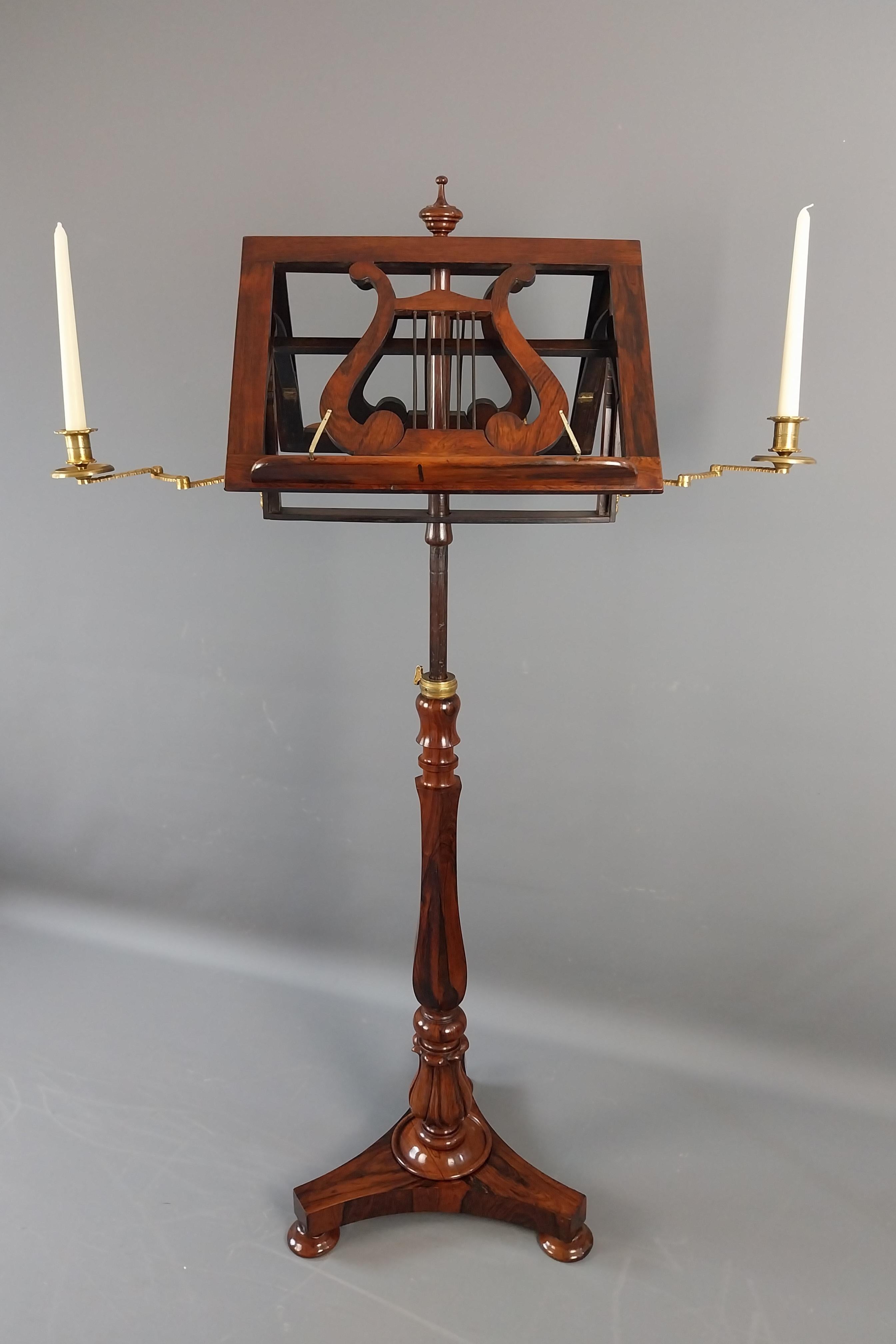 A fine Regency Period Rosewood Duet Musicians Stand with Lyre shaped sheet music rest which pivots and also adjusts in height to suit the musicians requirements this superb quality Music stand also benefits from gilded bronze candle sticks which can