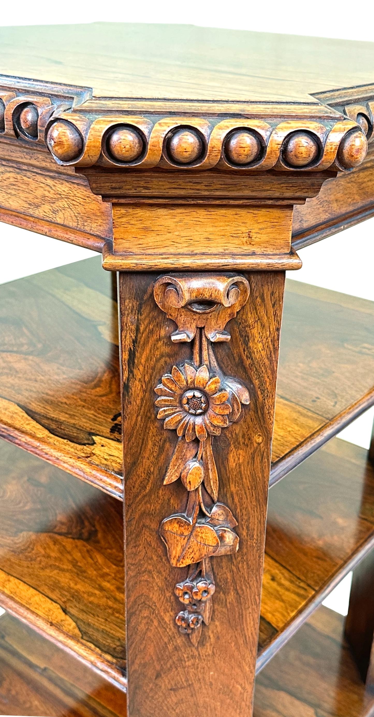 A Superb Quality And Rare Late Regency Period Rosewood Freestanding Open Bookcase, Or Central Standing Pedestal, Having Superbly Figured Top With Heavily Carved Moulded Edge, Raised On Four Canted Corner Supports With Crisp Carved Foliate Decoration