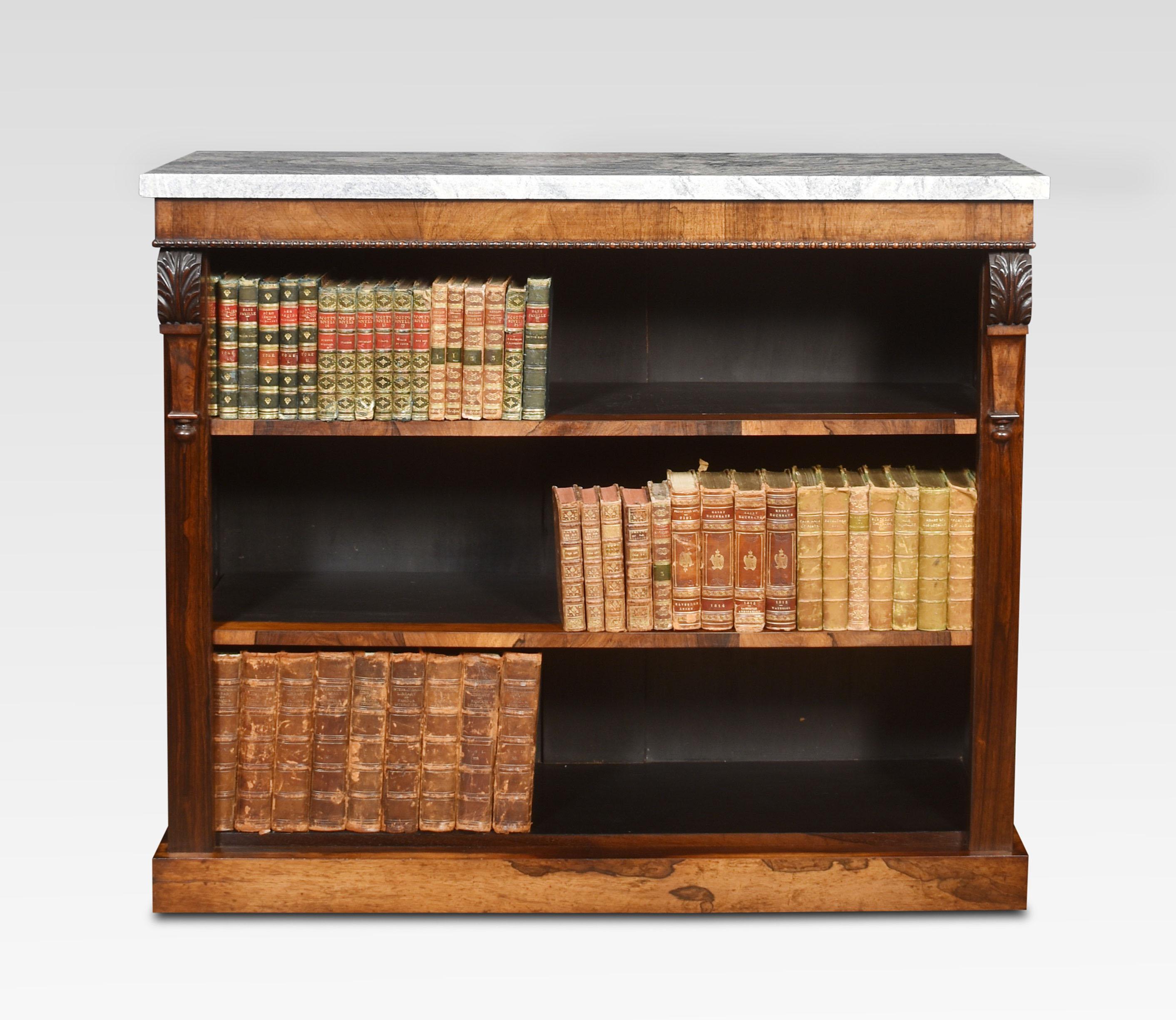 19th-century rosewood open bookcase, the rectangular marble top above carved frieze supported on cared acanthus capped columns. Enclosing two adjustable shelves, all raised up on plinth base.
Dimensions
Height 38.5 inches
Width 45.5 inches
Depth